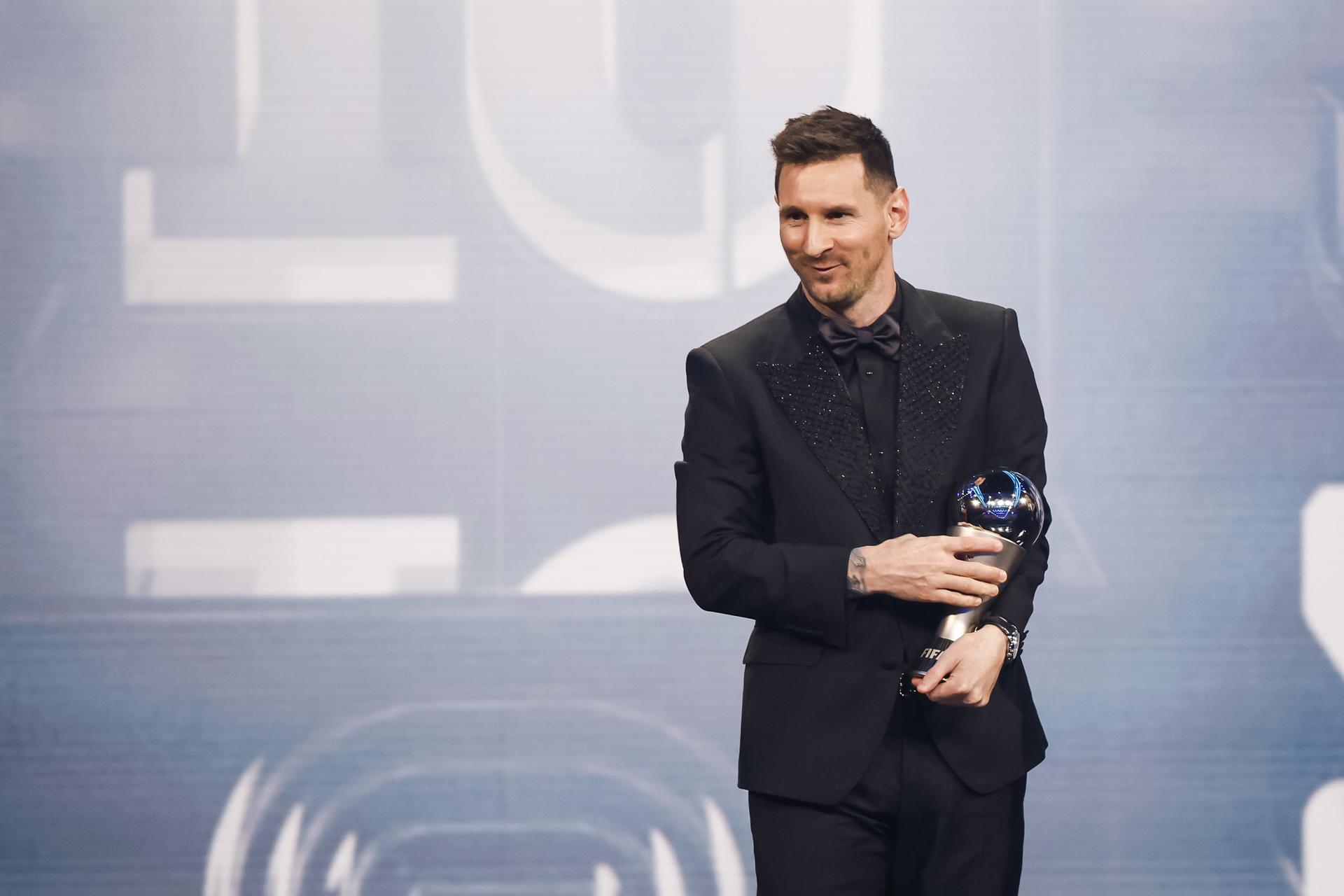 Argentine great Lionel Messi holds his trophy after winning the 2022 The Best FIFA men's player of the year award at a ceremony in Paris, France, on 27 February 2023. The 35-year-old Messi won the prize just over two months after leading his country to victory in the 2022 World Cup in Qatar, a tournament where he was named the most outstanding player. EFE/EPA/YOAN VALAT