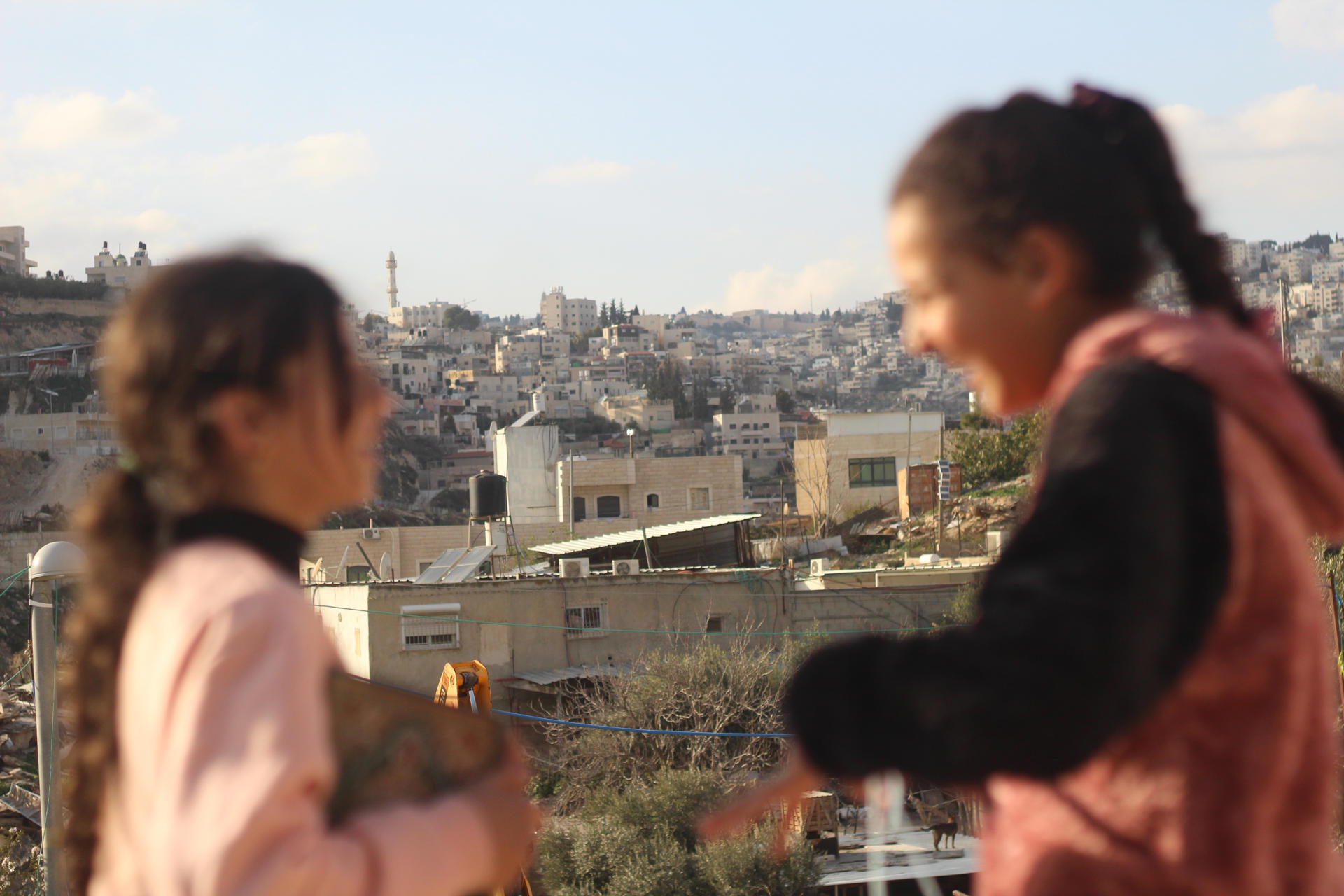 Two girls play in the Jabal Mukaber neighborhood, in occupied East Jerusalem, 3 March 2023. EFE/ Joan Mas Autonell