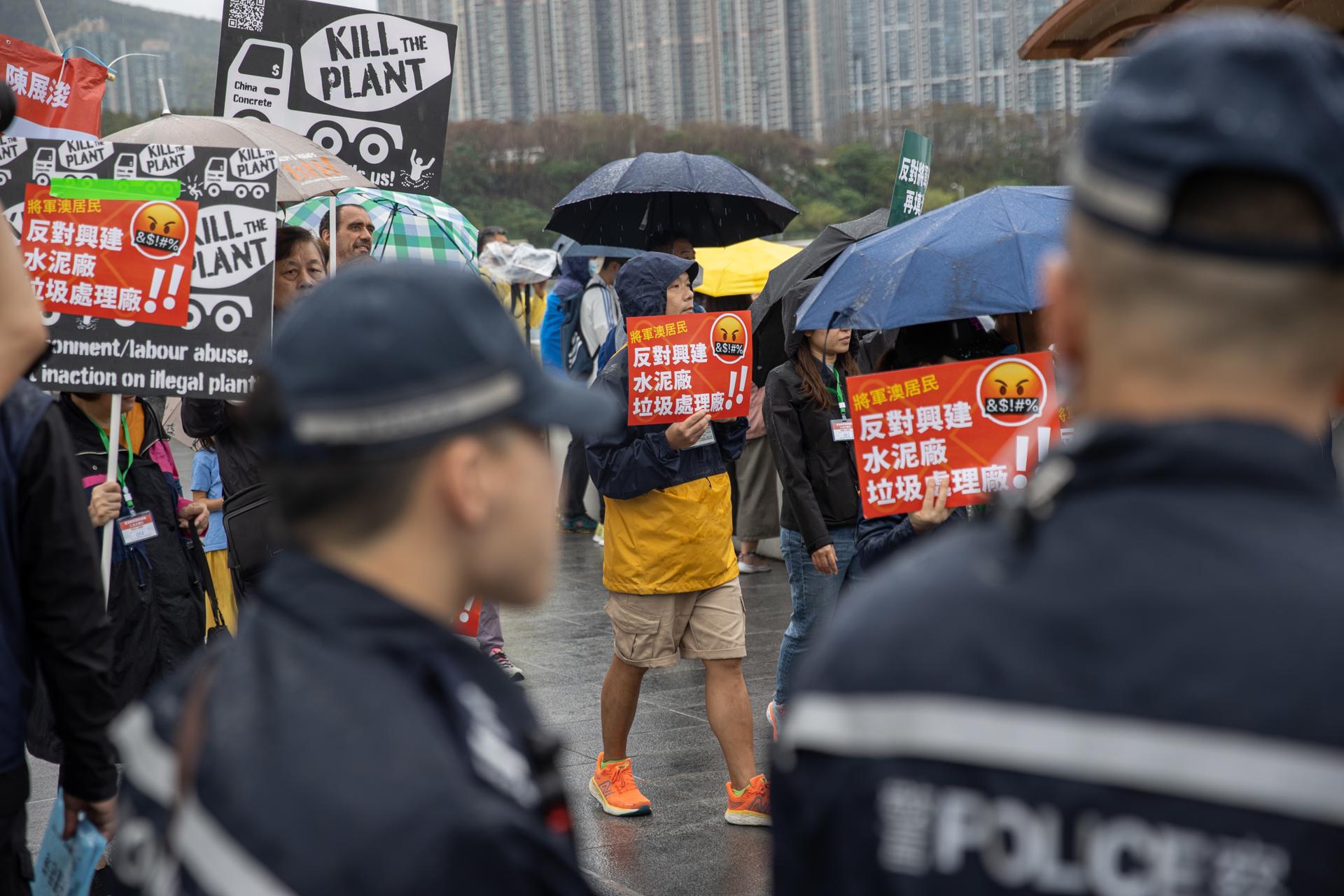 Homeowners wearing number tags around their neck attend a rally against a reclamation plan in Hong Kong, China, 26 March 2023. EFE/EPA/JEROME FAVRE