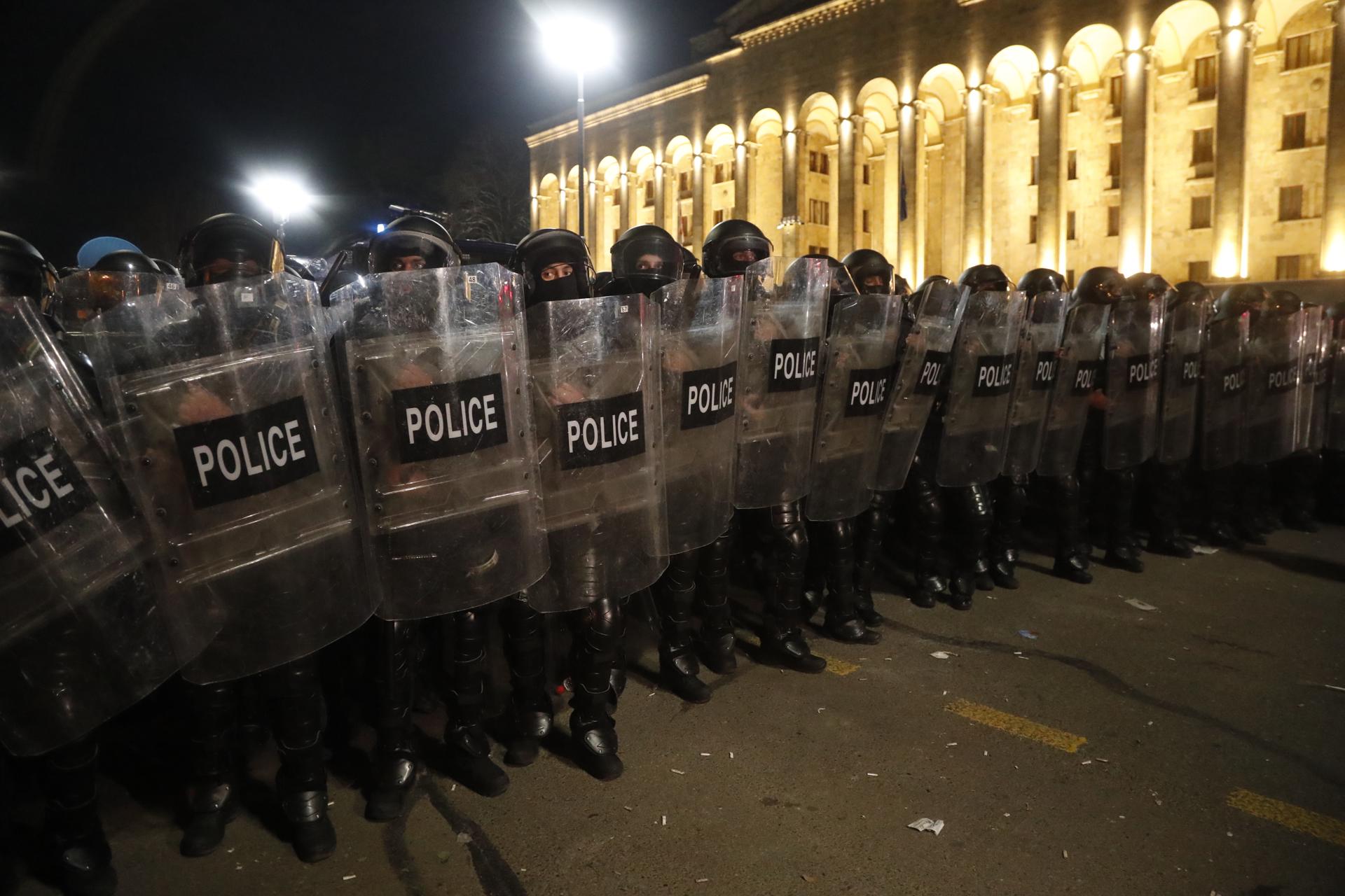 Georgian riot police stand in line during a rally to protest against the adoption of the so-called 'Foreign Agents Law' in front of the Parliament building in Tbilisi, Georgia, 08 March 2023. EFE/EPA/ZURAB KURTSIKIDZE