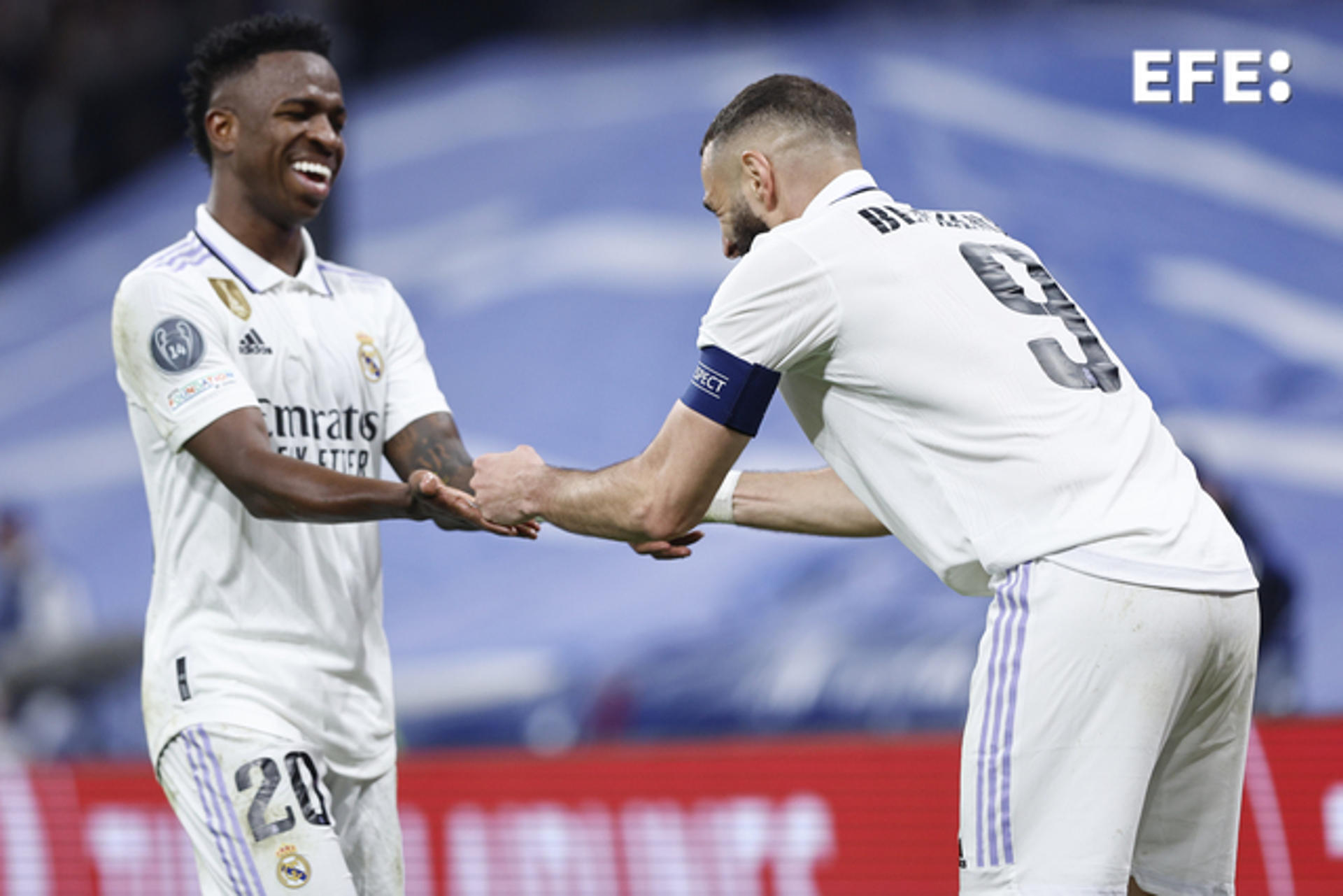 Real Madrid's Karim Benzema (R) celebrates with teammate Vinicius Jr . after scoring against Liverpool during the Champions League round of 16 second leg at the Santiago Bernabeu in Madrid on 15 March 2023. EFE/Rodrigo Jimenez