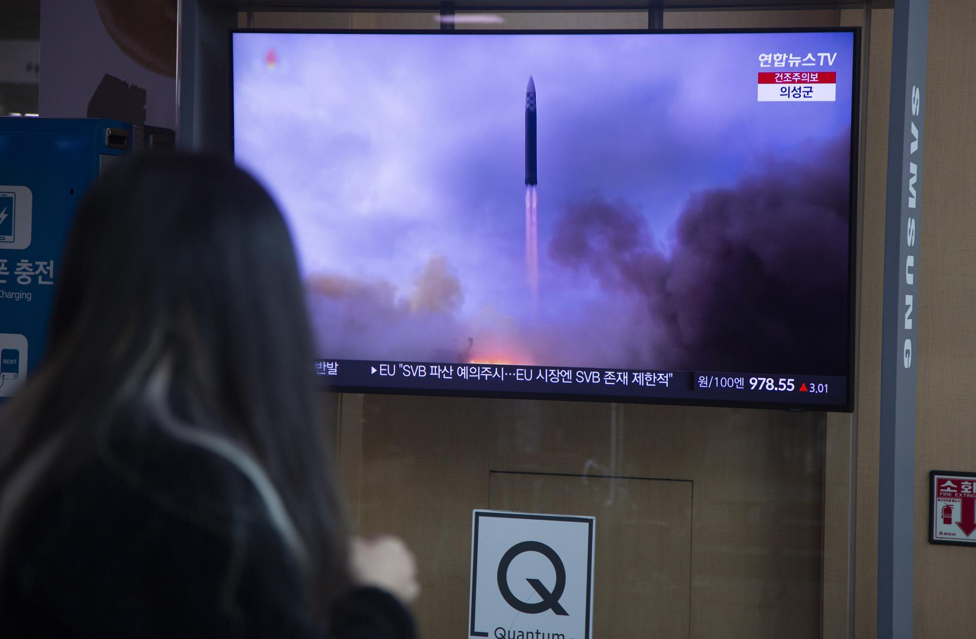 A woman watches the news at a station in Seoul, South Korea, 14 March 2023. EFE-EPA FILE/JEON HEON-KYUN