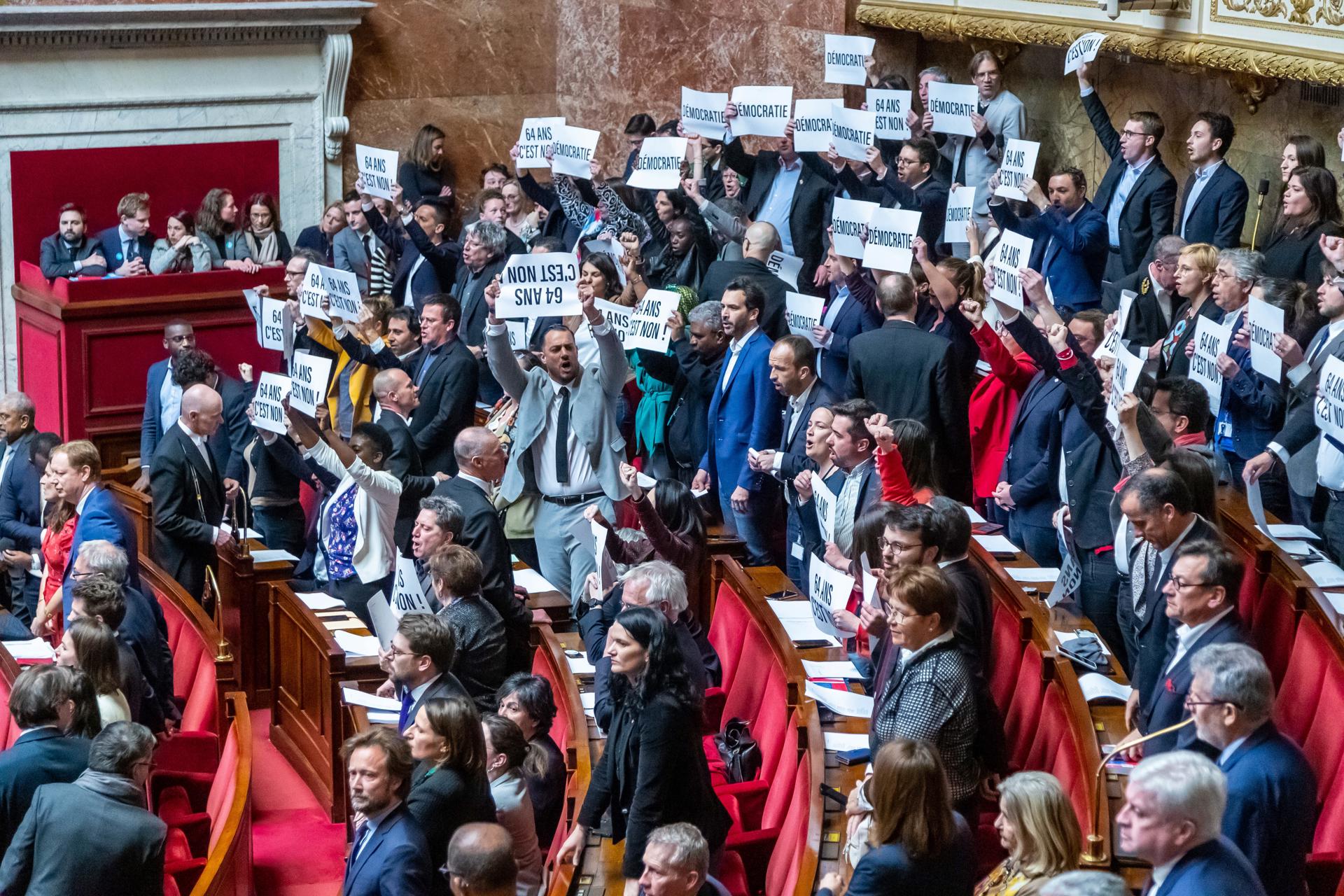 French Deputies of NUPES coalition (New Ecological and Social Union) show posters reading 'No to 64 years old' at the National Assembly in Paris, France, 16 March 2023. EFE/EPA/CHRISTOPHE PETIT TESSON