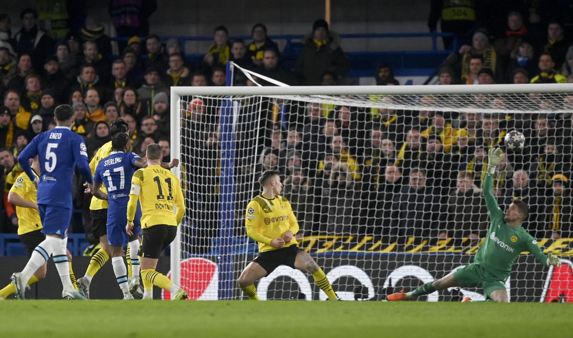 Chelsea's Raheem Sterling (No. 17) beats Borussia Dortmund goalkepeer Alexander Meyer (R) during the UEFA Champions League round of 16 second leg in London on 7 March 2023. EFE/EPA/Neil Hall