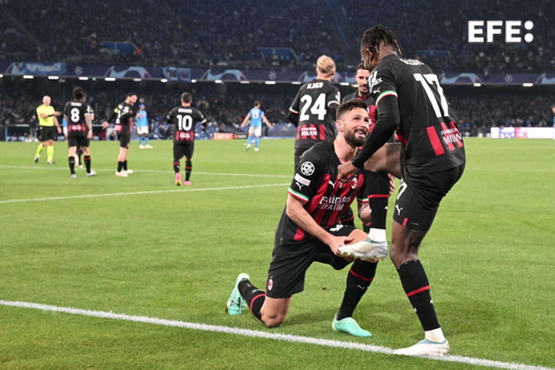 AC Milan's Olivier Giroud (L) celebrates with teammate Rafael Leao after scoring against Napoli during the UEFA Champions League quarterfinal second leg in Naples, Italy, on 18 April 2023. EFE/EPA/CIRO FUSCO
