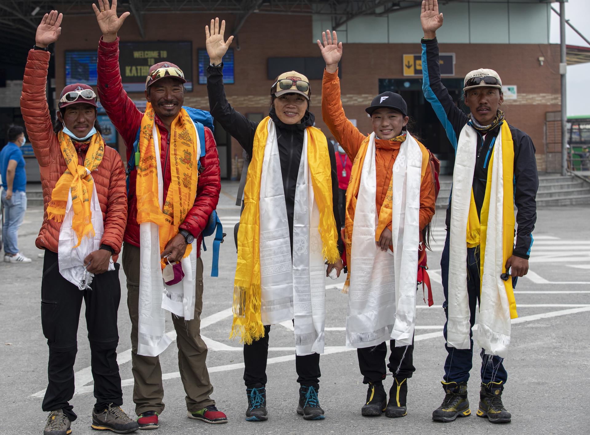 (FILE) Hong Kong climber Tsang Yin-hung (C) waves along with her expedition team members upon her arrival from Everest base camp in Kathmandu, Nepal, 30 May 2021. EFE/EPA/NARENDRA SHRESTHA