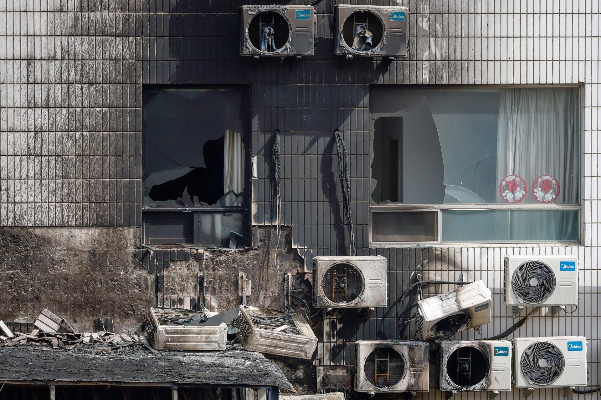A view of broken windows and burned air conditioners following a fire at the Changfeng Hospital in Beijing, China, 19 April 2023. EFE-EPA/MARK R. CRISTINO