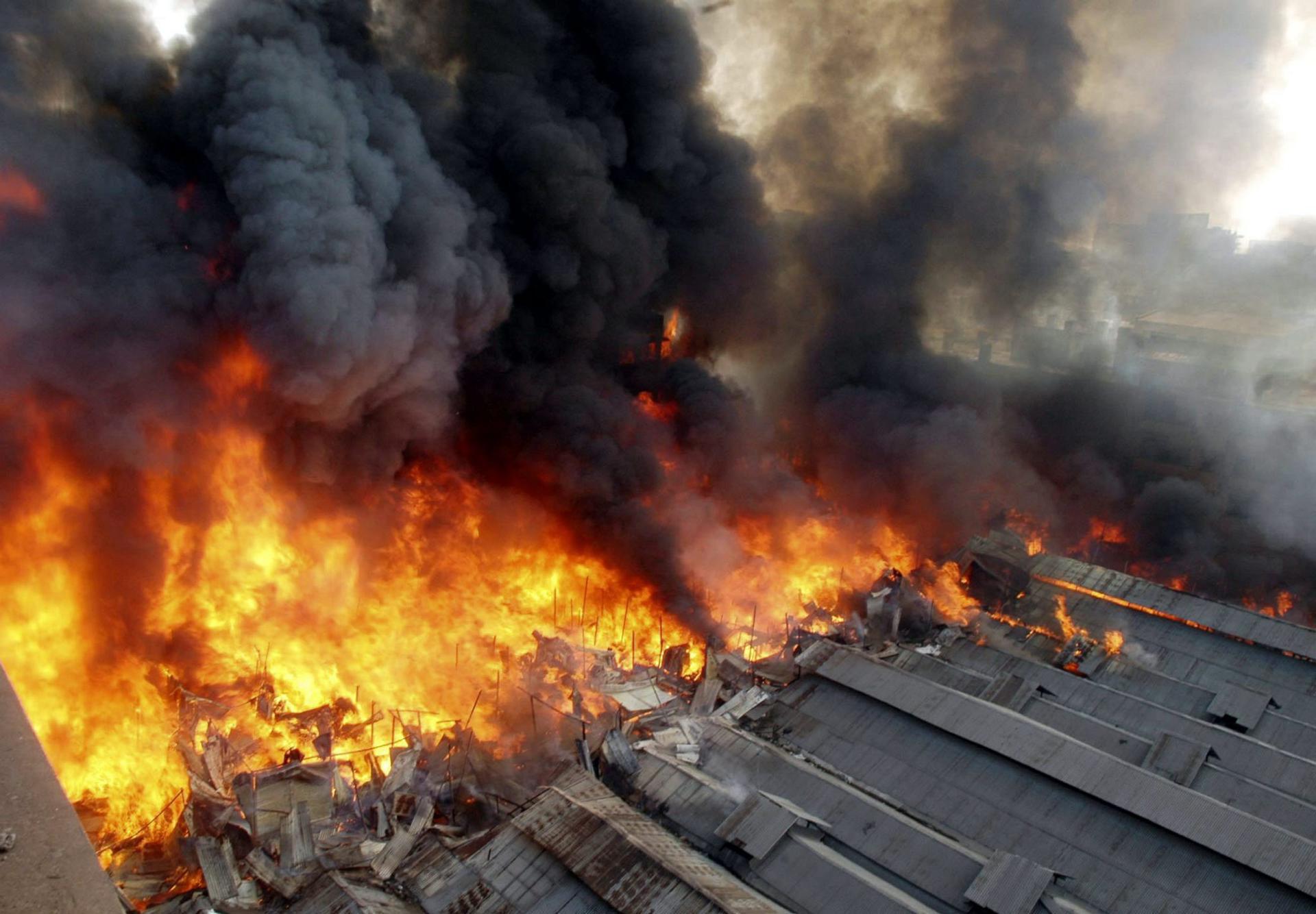 A fire rages through a market in Dhaka, Bangladesh, on Sunday, 21 November 2004. EPA/FILE/STR