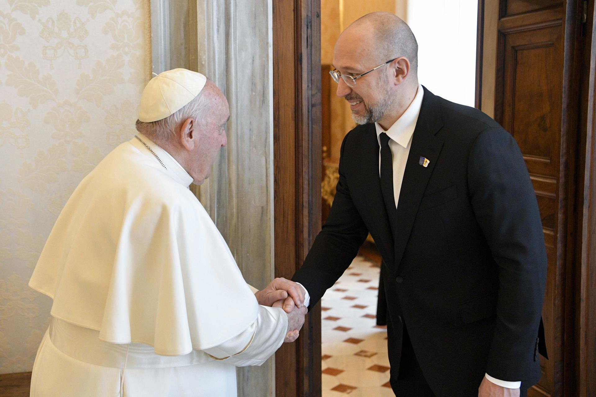 A handout picture provided by the Vatican Media shows Pope Francis (L) shaking hands with Ukraine's Prime Minister Denys Shmyhal before a meeting, Vatican City, 27 April 2023. EFE-EPA/VATICAN MEDIA HANDOUT HANDOUT EDITORIAL USE ONLY/NO SALES