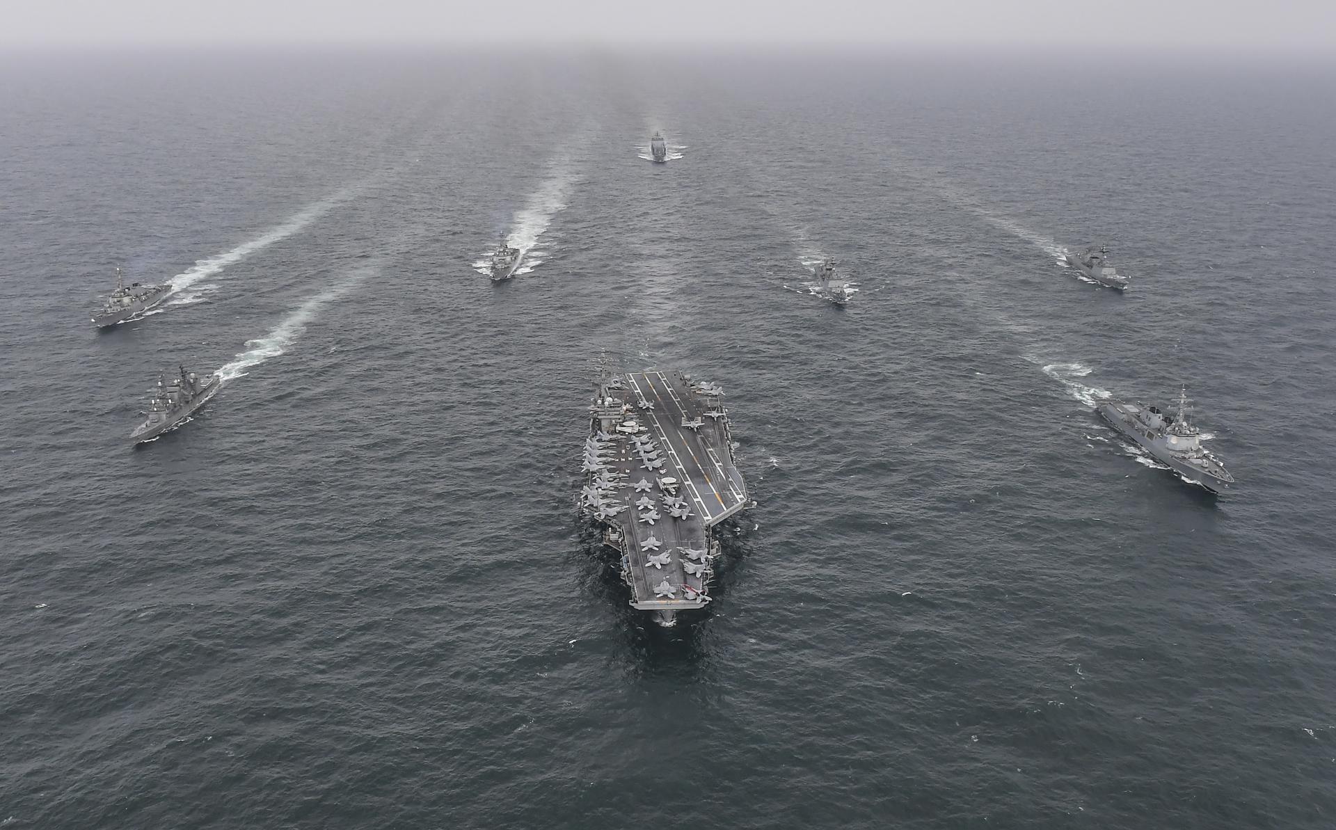 A handout photo made available by the South Korean Defense Ministry shows US Navy's aircraft carrier USS Nimitz CVN-68 (front C), South Korean Navy's destroyer Yulgok Yi I DDG-992 (front R) and Japan Maritime Self-Defense Force's Umigiri DD-158 (front L) during a joint naval exercise in South Korea, 04 April 2023. EFE-EPA/South Korean Defense Ministry HANDOUT EDITORIAL USE ONLY/NO SALES