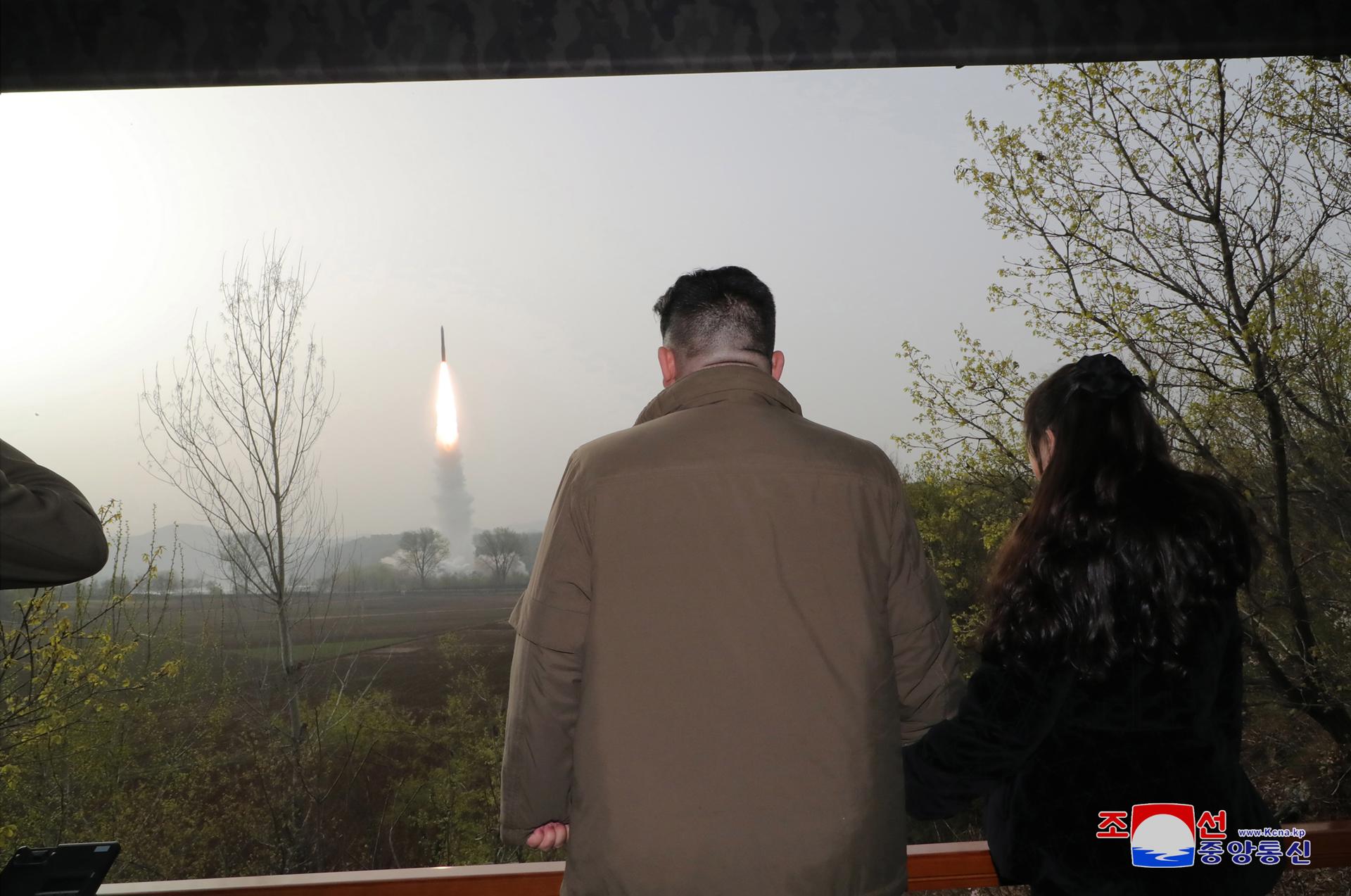 A photo released by the official North Korean Central News Agency (KCNA) shows North Korean leader Kim Jong Un (L) and his daughter Kim Ju Ae observing the test firing of a new solid-fuel Hwasong-18 intercontinental ballistic missile (ICBM) at an undisclosed location in North Korea, 13 April 2023 (Issued 14 April 2023). EFE-EPA FILE/KCNA EDITORIAL USE ONLY EDITORIAL USE ONLY