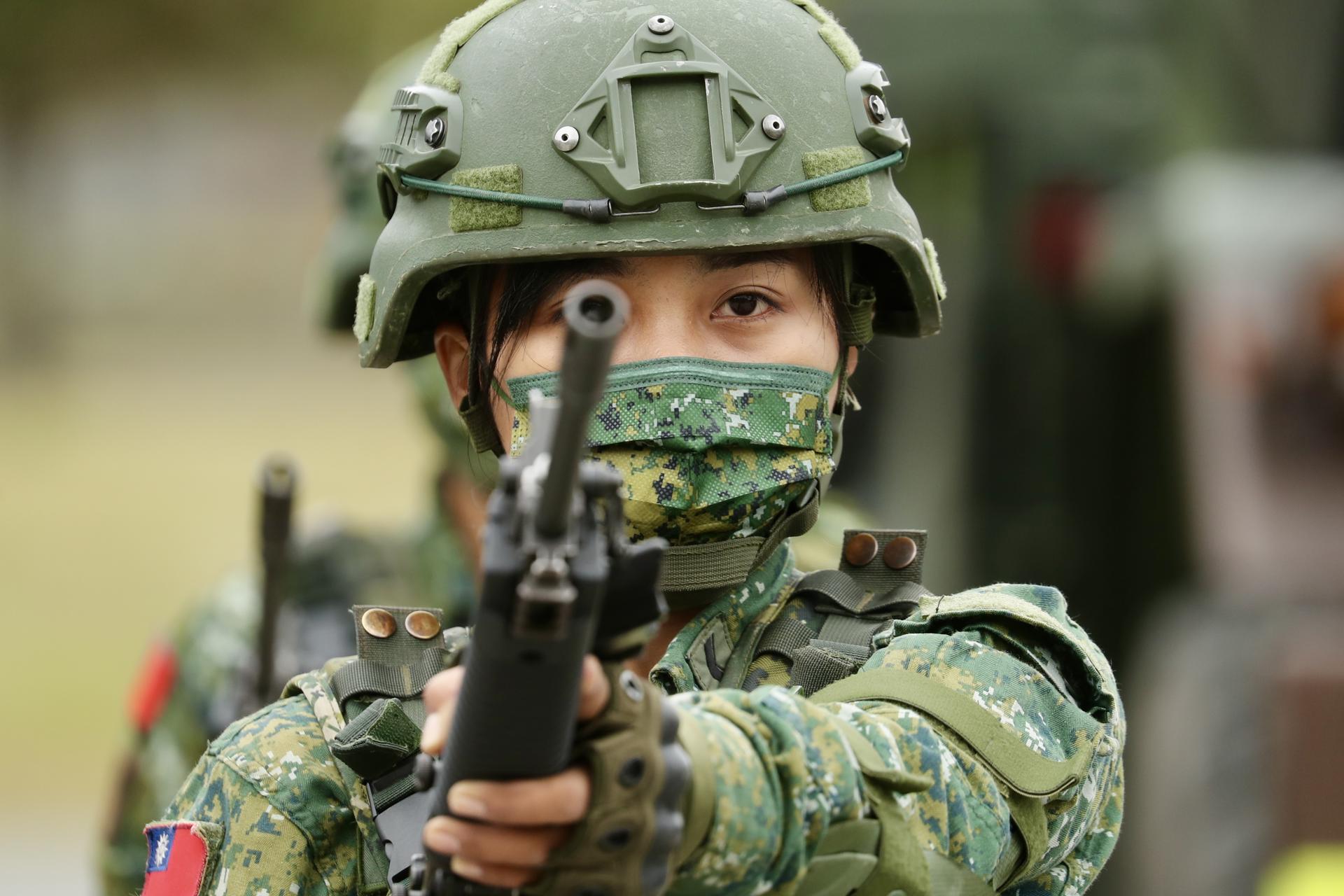 A Taiwanese military soldier holds a riffle during the visit of Taiwan President Tsai Ing-wen (not pictured) at a military base in Taitung, Taiwan, 21 January 2022. EFE-EPA/RITCHIE B. TONGO