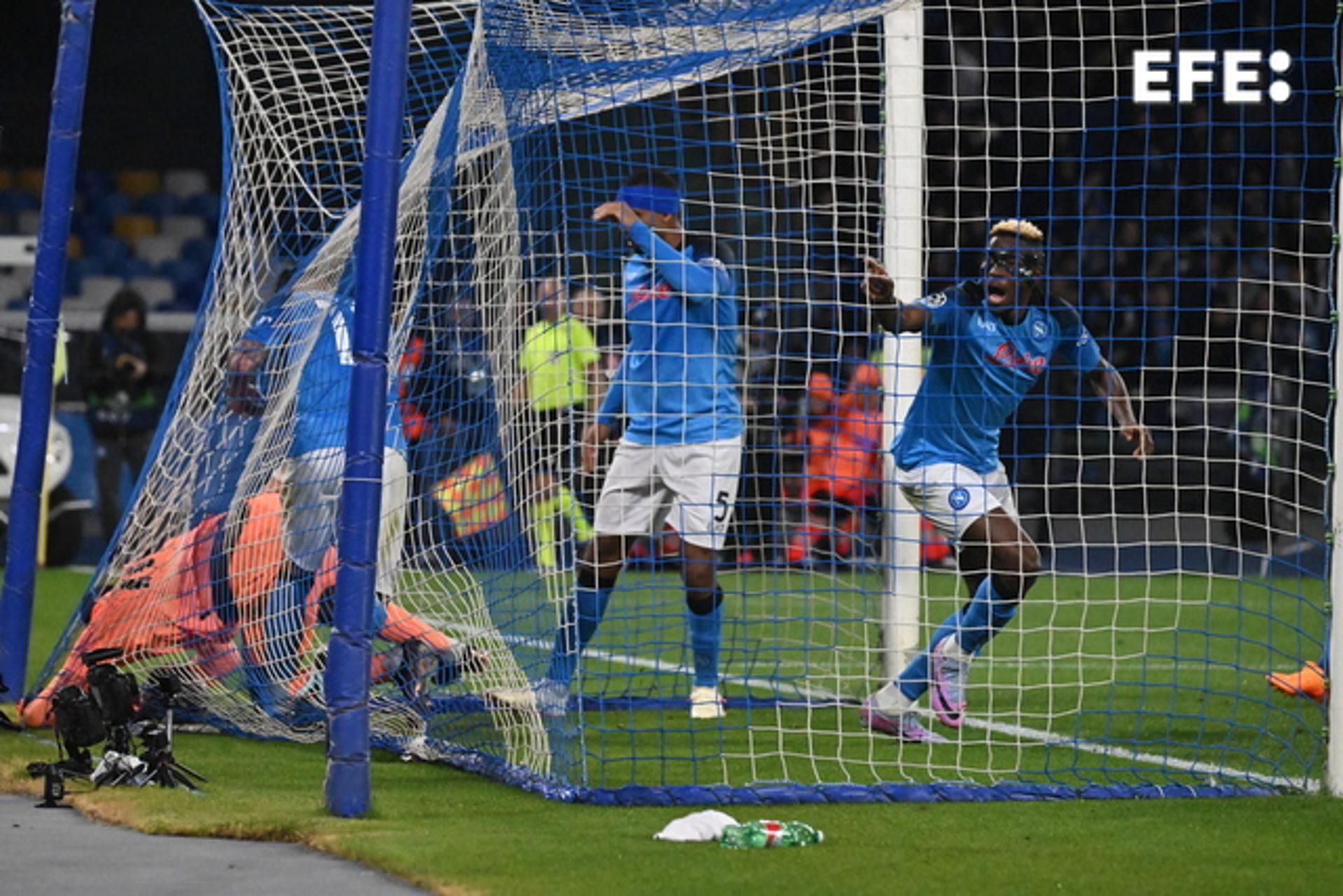 Napoli's Victor Osimhen (R) scores against AC Milan during the UEFA Champions League quarterfinal second leg in Naples, Italy, on 18 April 2023. EFE/EPA/CIRO FUSCO
