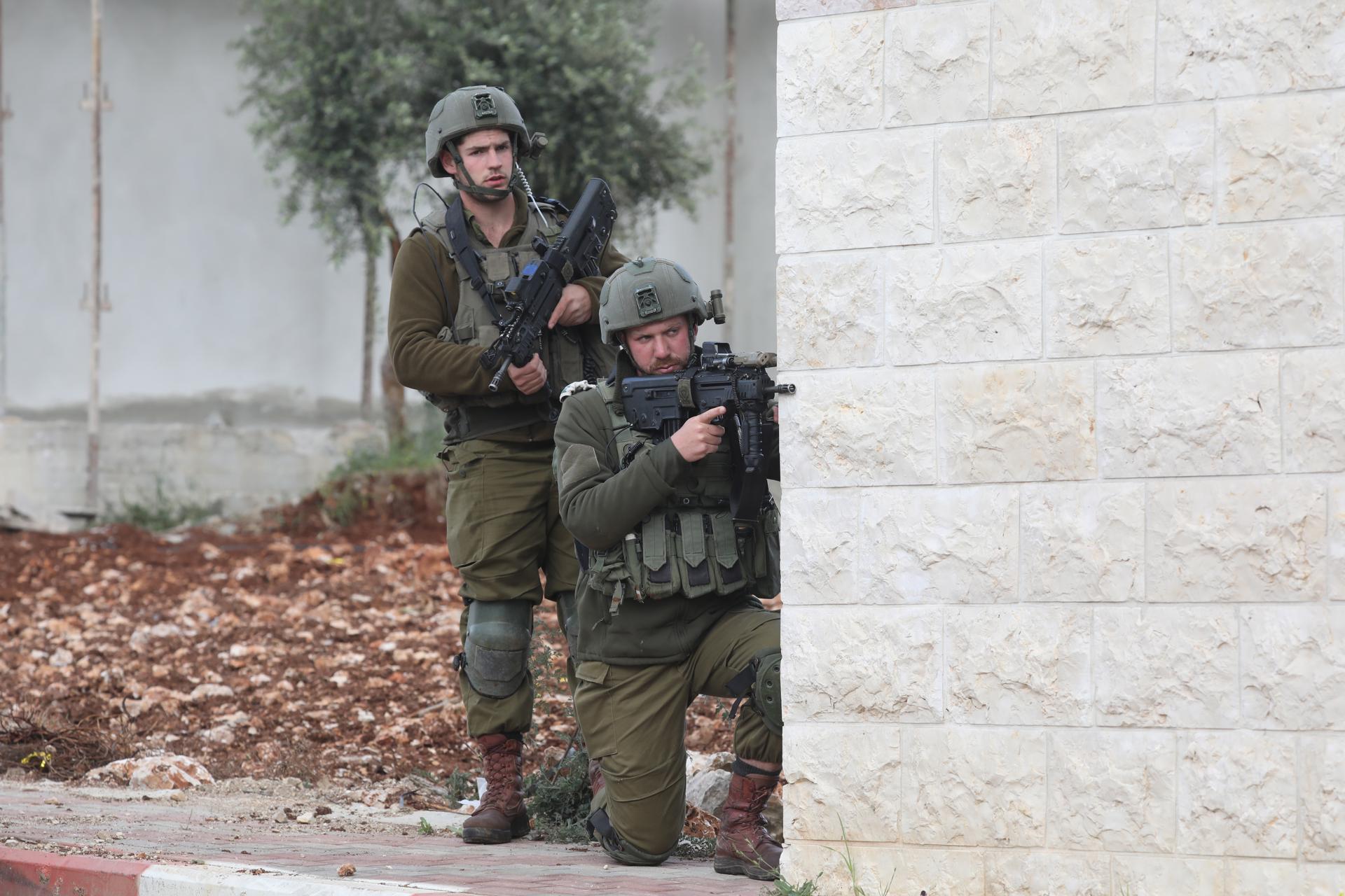 Israeli soldiers take positions in the area where two Palestinian militants were killed, near the settlement of Elon Moreh near the west bank city of Nablus, 11 April 2023. EFE/EPA/ALAA BADARNEH