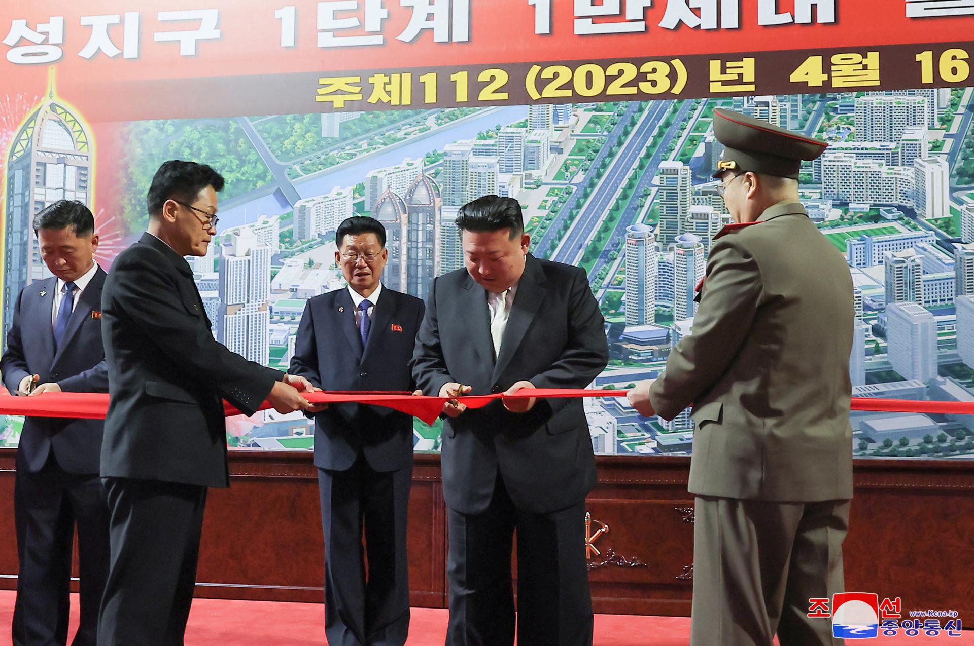 A photo released by the official North Korean Central News Agency (KCNA) shows North Korean leader Kim Jong Un (2-R) cutting the red ribbon during an inauguration ceremony for 10,000 new flats in the Hwasong area in Pyongyang, North Korea, 16 April 2023 (issued 17 April 2023). EFE/EPA/KCNA EDITORIAL USE ONLY