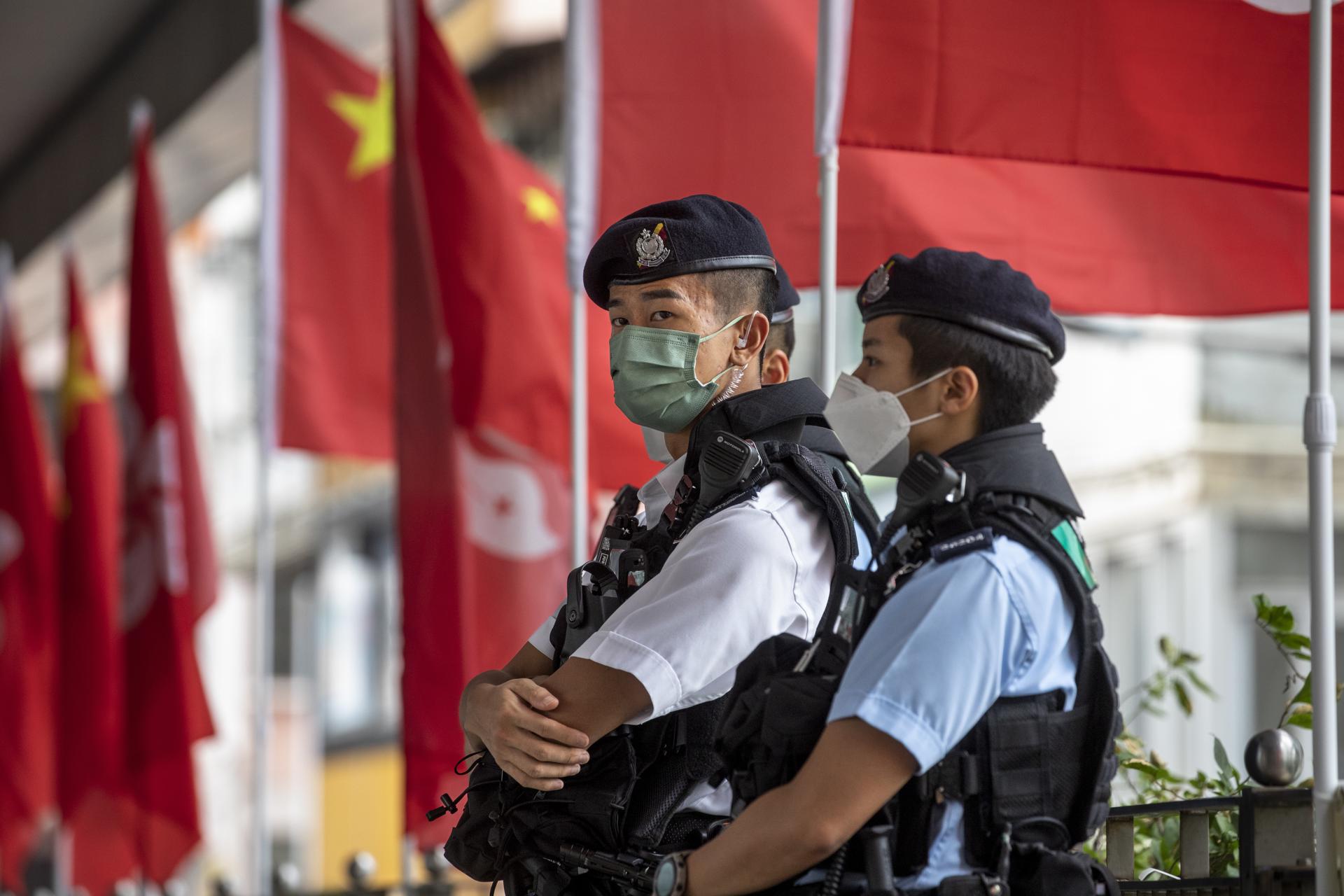 Police officers stand guard during China's National Day in Hong Kong, China, 01 October 2022. EFE-EPA FILE/MIGUEL CANDELA
