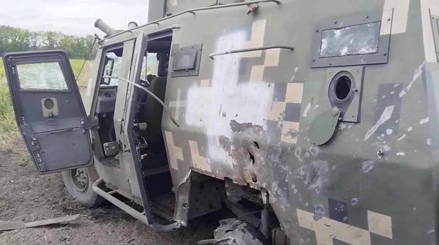 Still from video provided by the Russian Defense Ministry of destroyed armored fighting vehicles in the Grayvoronsky district of Belgorod region, Russia.