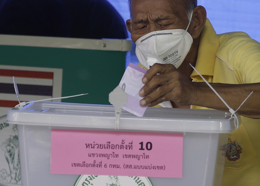 A man votes in Thailand's general election at a Bangkok school. 