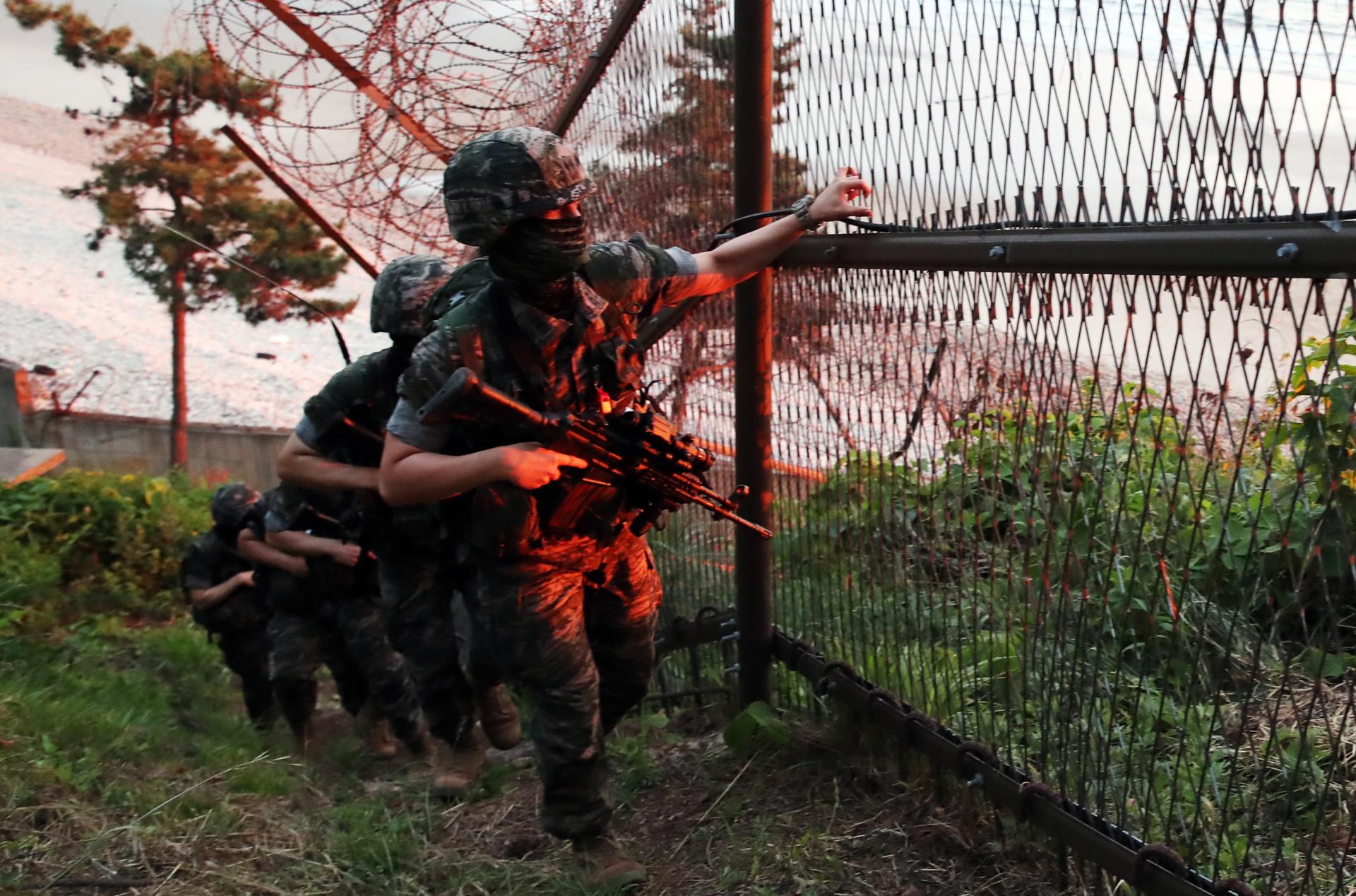 South Korean Marines patrol a perimeter fence of Yeonpyeong Island in the Yellow Sea just south of the Northern Limit Line of the inter-Korean maritime border, in South Korea, 16 June 2020. EFE-EPA FILE/YONHAP SOUTH KOREA OUT