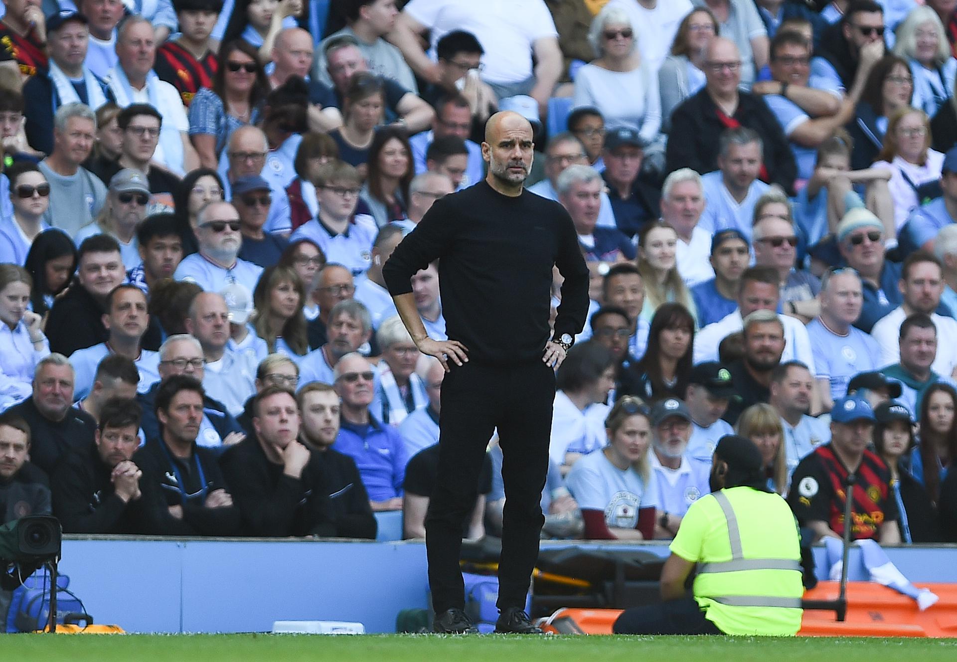 Manchester City manager Pep Guardiola views the action in the team's match vs. Chelsea match at Etihad Stadium in Manchester, England, on May 21, 2023. EFE/EPA/PETER POWELL
