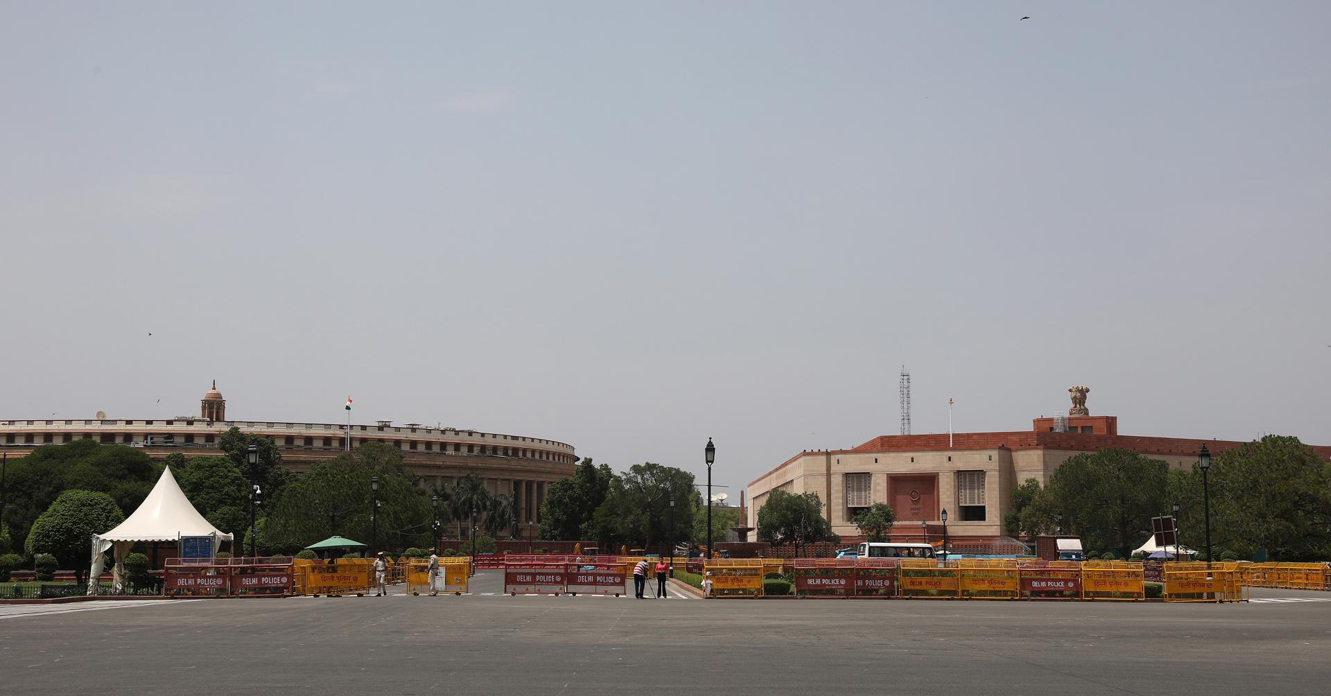 An exterior view of the old Parliament building (L) and the newly constructed Indian Parliament building in New Delhi, India, 26 May 2023. EFE/EPA/RAJAT GUPTA