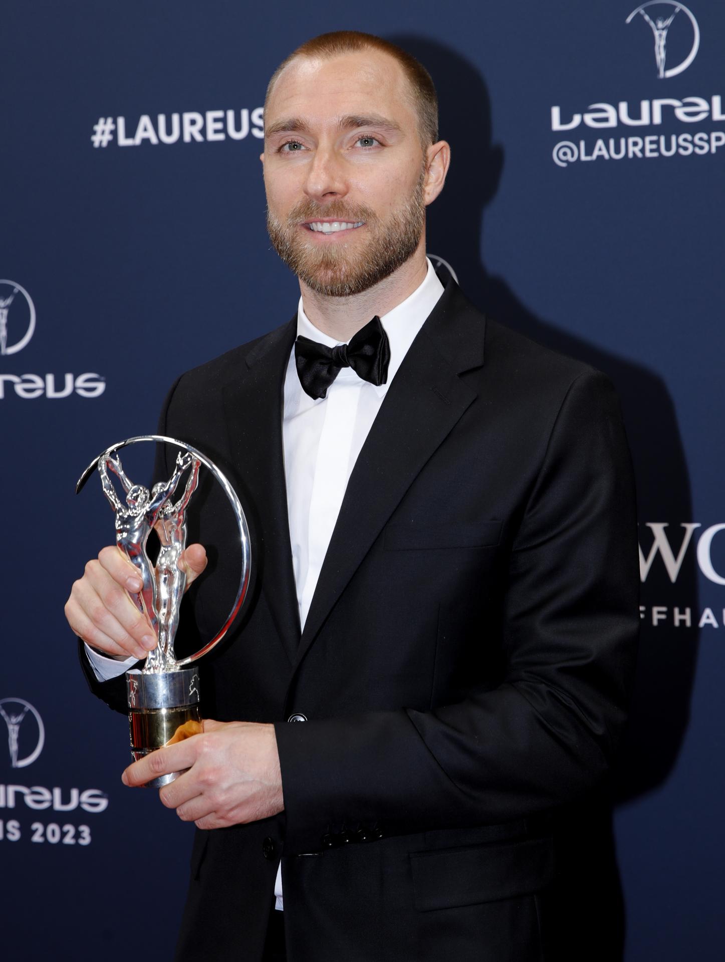 Manchester United midfielder Christian Eriksen holds up the trophy he received on 8 May 2023 in Paris, France, at the Laureus World Sports Awards ceremony. The 31-year-old Dane, who suffered cardiac arrest on the field in June 2021, was honored in the Comeback of the Year category. EFE/EPA/TERESA SUAREZ
