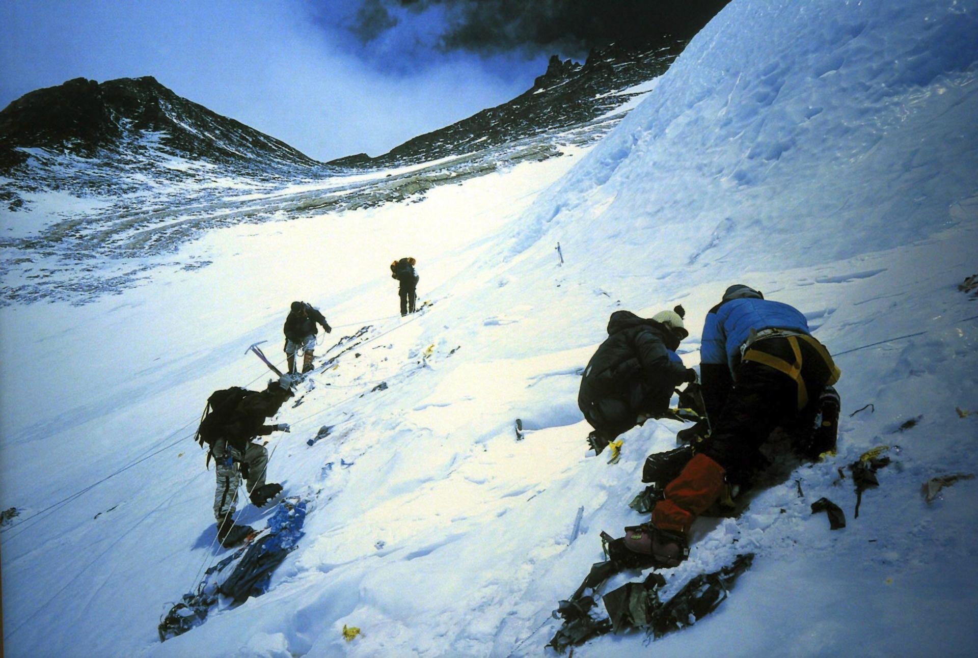 An undated handout picture showing members of Mount Everest Clean up expedition digging out tents from the snow on the Sagarmatha route on Mount Everest. EPA-PHOTO/EPA/FILE/HARISH TYAGI