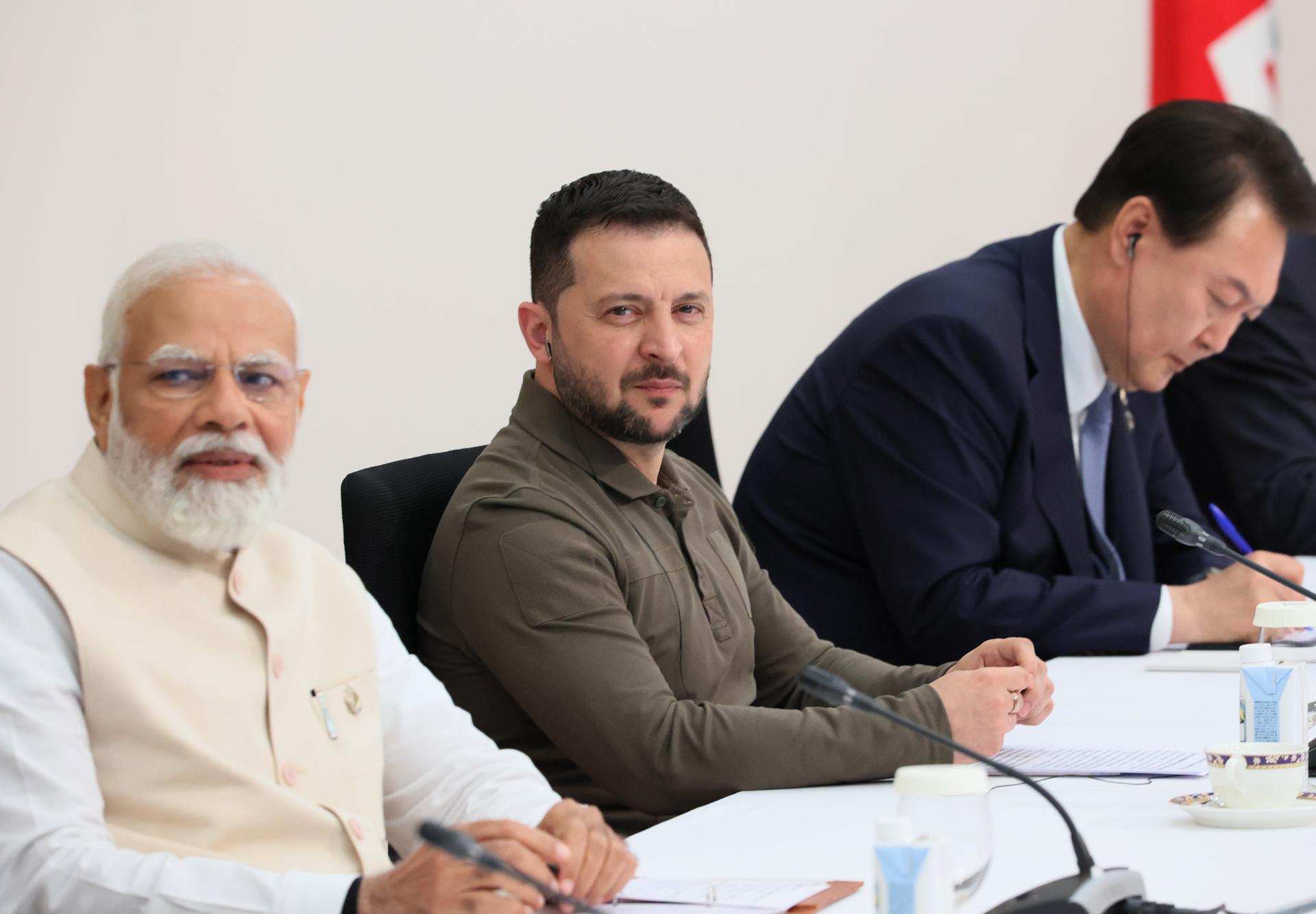 A handout photo made available by the G7 Hiroshima Summit Host shows Ukraine's President Volodymyr Zelensky (C), Indian Prime Minister Narendra Modi (L) and South Korea's President Yoon Suk-yeol (R) attending a session at the G7 Hiroshima Summit in Hiroshima, Japan, 21 May 2023. EFE/EPA/G7 Hiroshima Summit Host