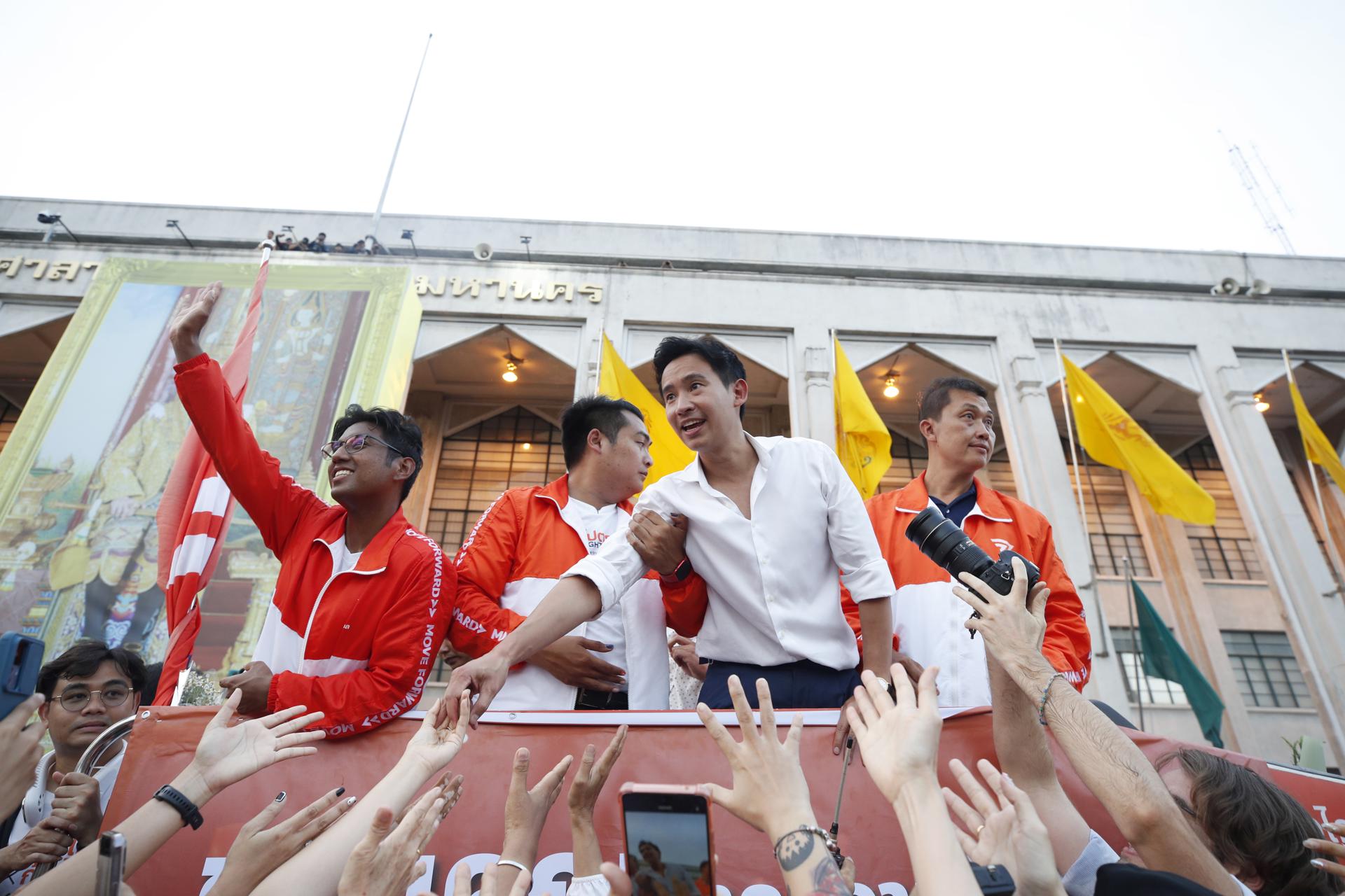 Move Forward Party's leader and prime ministerial candidate Pita Limjaroenrat (2-R) greets supporters during a parade to thank voters after winning the general election at the city hall in Bangkok, Thailand, 15 May 2023. EFE/EPA/RUNGROJ YONGRIT