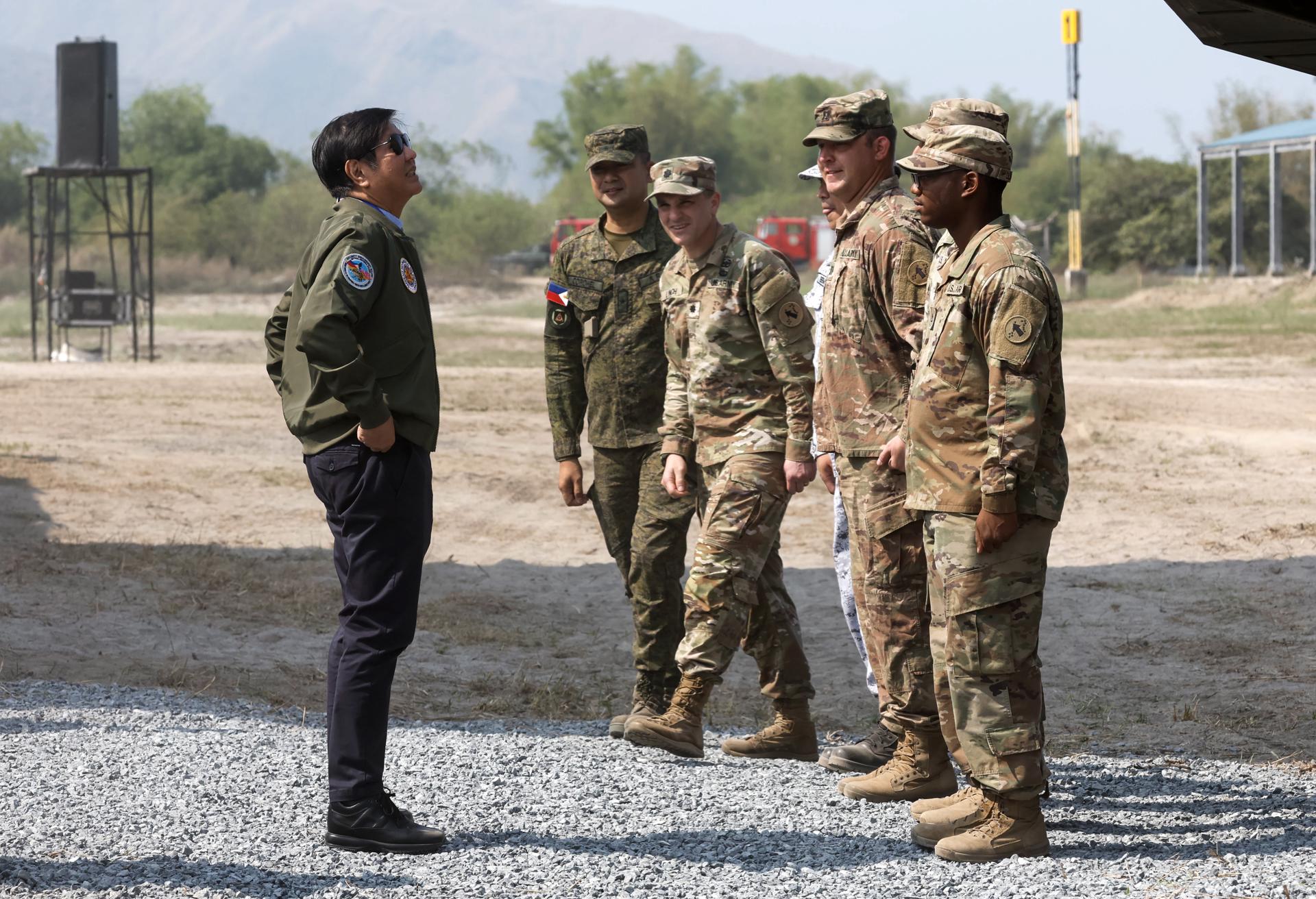 Philippines President Ferdinand Marcos Jr. (L) with US and Filipino military officers for a briefing during the Philippines-US 38th Balikatan Exercises at Naval Station Leovigildo Gantioqui in Zambales province, north of Manila, Philippines, 26 April 2023. EFE-EPA/ROLEX DELA PENA/FILE
