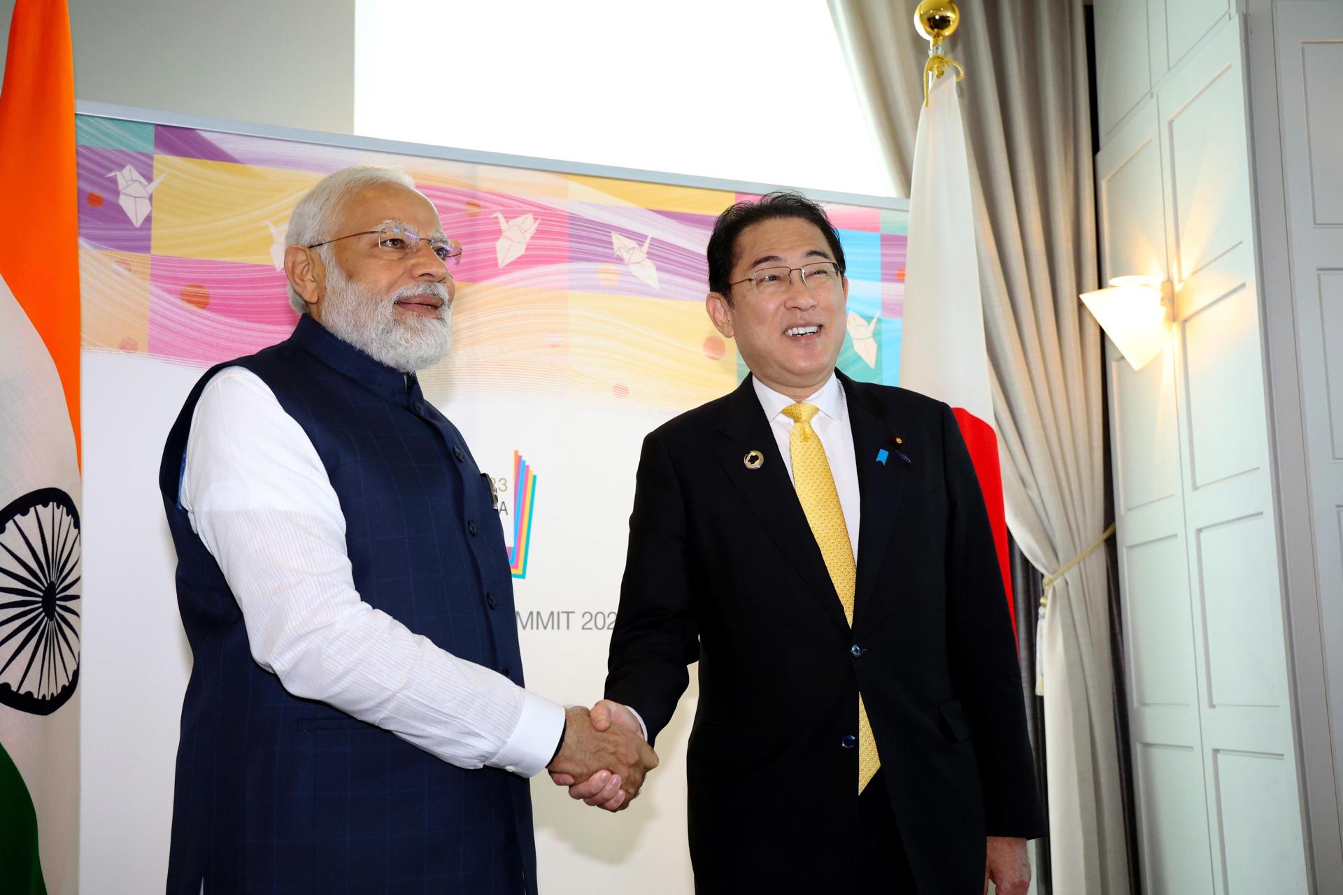 India's Prime Minister Narendra Modi (L) and Japan's Prime Minister Fumio Kishida shake hands during a bilateral meeting on the sidelines of the G7 Hiroshima Summit in Hiroshima, Japan, 20 May 2023. EFE/EPA/JAPAN POOL JAPAN OUT EDITORIAL USE ONLY/NO SALES