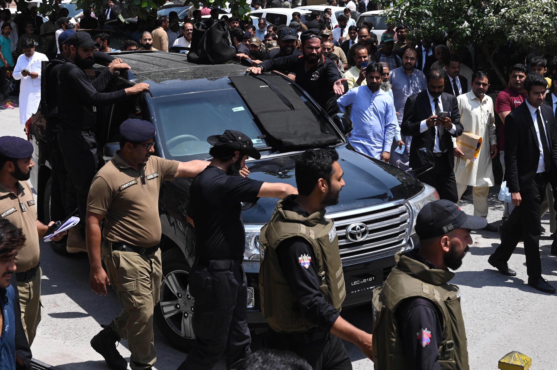 A vehicle partially covered with a bulletproof sheet and carrying Pakistan's former Prime Minister Imran Khan (not pictured) arrives at the Lahore High Court for a pre-arrest bail in a murder case related to one of his party'Äôs workers, in Lahore, Pakistan, 06 June 2023. EFE-EPA/RAHAT DAR
