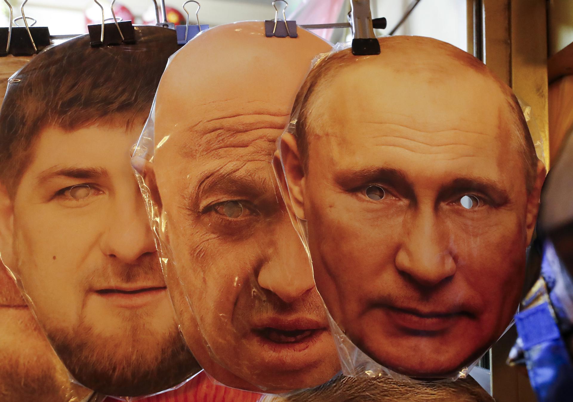 (L-R) Face masks depicting Chechen Republic's regional leader Ramzan Kadyrov, owner of PMC (Private Military Company) Wagner Yevgeny Prigozhin and Russian President Vladimir Putin are displayed for sale at a souvenir market in St. Petersburg, Russia, 26 June 2023. EFE-EPA/ANATOLY MALTSEV