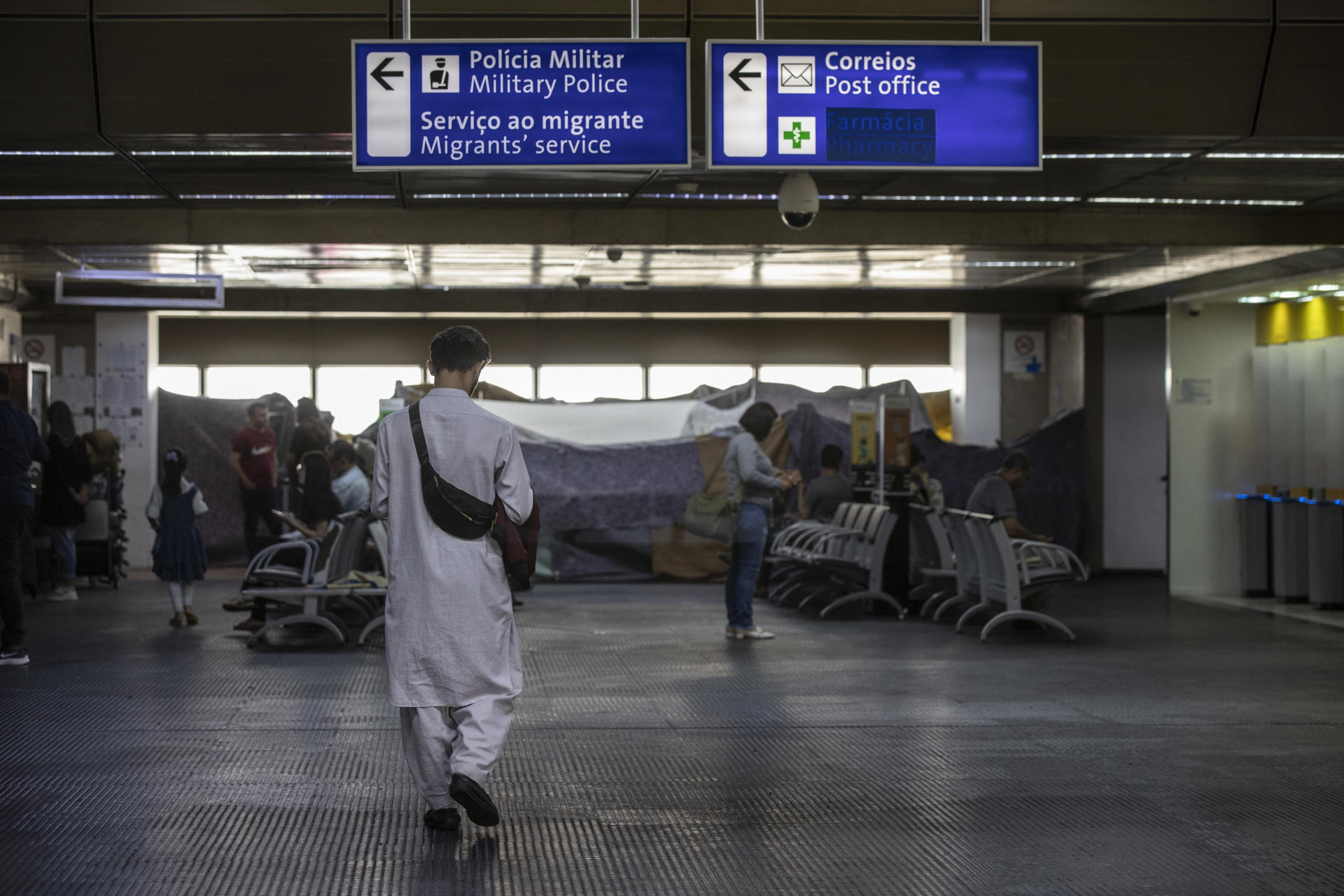 Scores of Afghans attracted to Brazil by the offer of humanitarian visas to people fleeing the Taliban have end up stuck at Sao Paulo International Airport waiting for authorities to find them shelter. EFE/SEBASTIÃO MOREIRA
