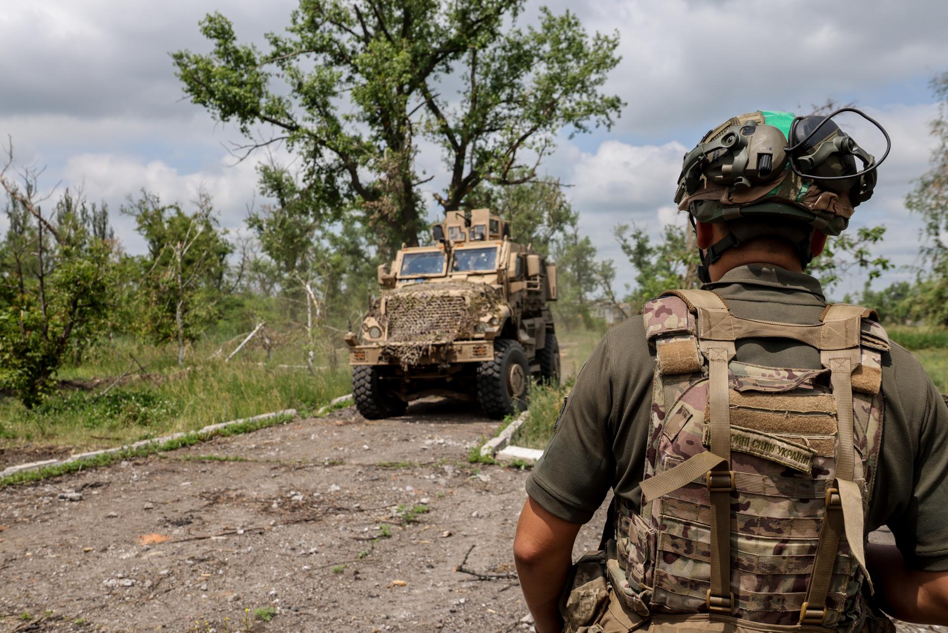 Ukrainian serviceman of the 688th Separate Jager Infantry Brigade 'Oleksa Dovbush' moves to the APC in the recently recaptured village of Blahodatne, Donetsk region, Ukraine, 17 June 2023. EFE-EPA/STRINGER