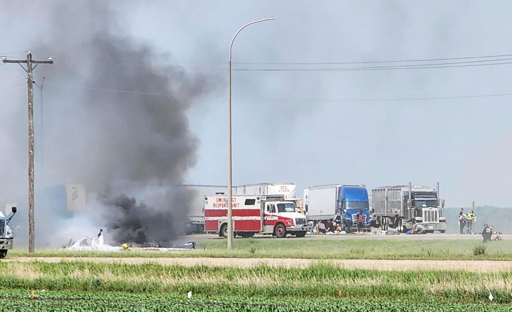 Emergency workers help at the scene of a fatal accident involving a truck and a minibus near the town of Carberry, in the province of Manitoba, in western Canada, on June 15, 2023. EFE/EPA/ Nirmesh Vadera