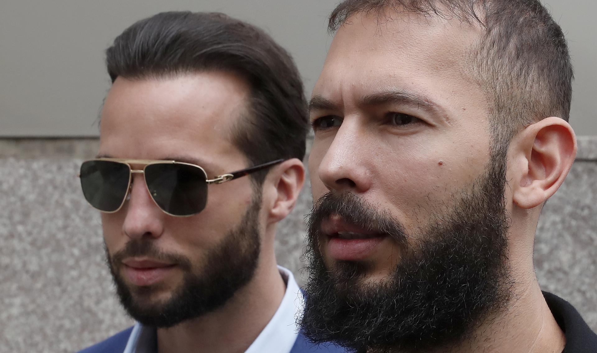 Former professional kickboxer and social media influencer Andrew Tate (R), is followed by his brother Tristan (L), as he leaves the court after being presented to a judge for an extension of their house arrest, in Bucharest, Romania, 21 April 2023.EFE/EPA/ROBERT GHEMENT