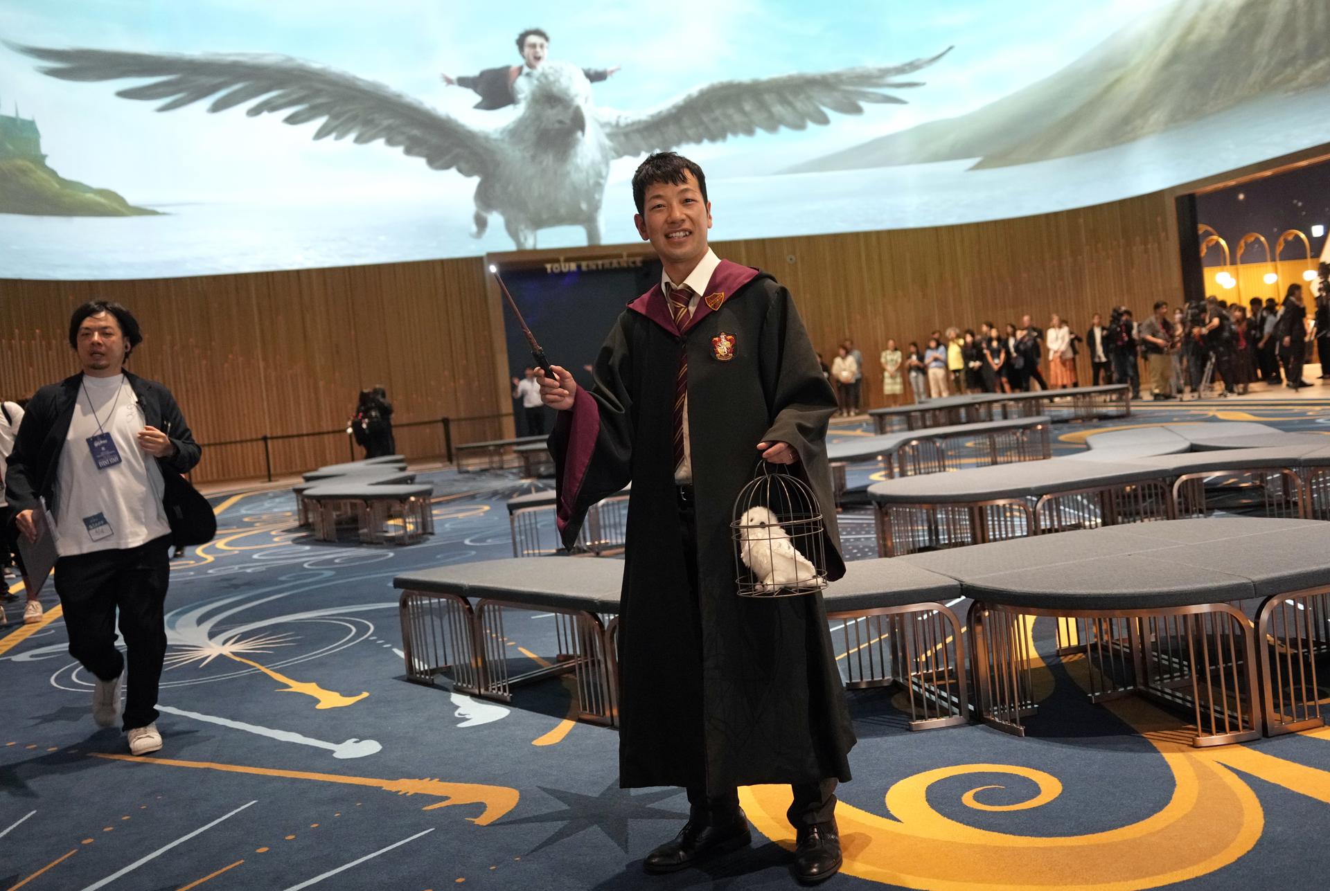 A visitor wearing a costume poses at the opening of the 'Warner Bros. Studio Tour Tokyo The Making of Harry Potter' theme park in Tokyo, Japan, 16 June 2023. EFE-EPA/FRANCK ROBICHON EDITORIAL USE ONLY
