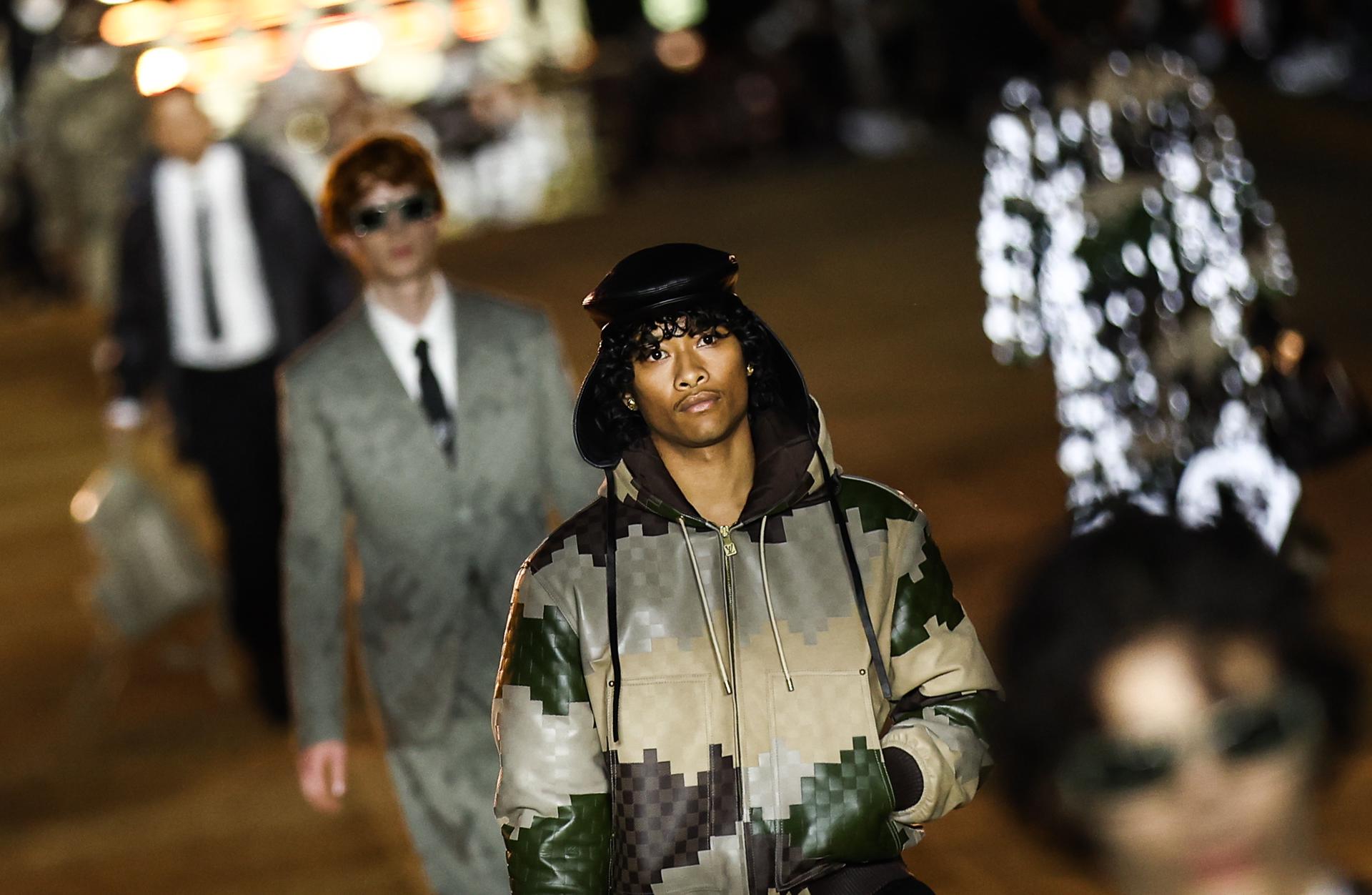 Models present creations from the Spring/Summer 2024 Men's collection by American designer Pharrell Williams for Louis Vuitton during the Paris Fashion Week, on the Pont Neuf bridge, in Paris, France, 20 June 2023. EFE/EPA/Mohammed Badra