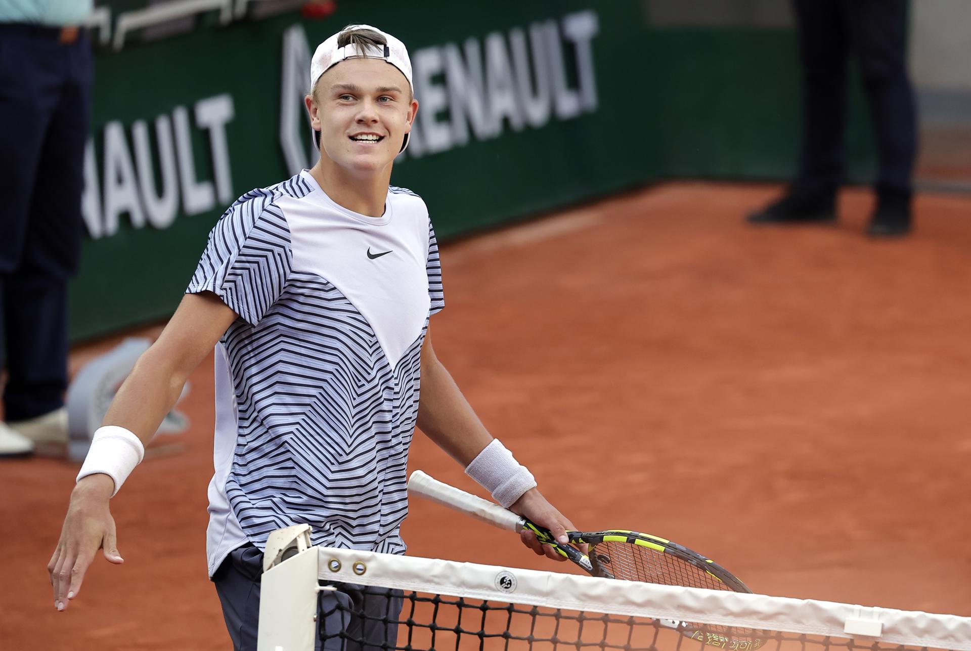 Holger Rune of Denmark smiles after defeating Argentina's Francisco Cerundolo 7-6 (7-3), 3-6, 6-4, 1-6, 7-6 (10-7) in French Open fourth-round action in Paris, France on 5 June 2023. EFE/EPA/CHRISTOPHE PETIT TESSON
