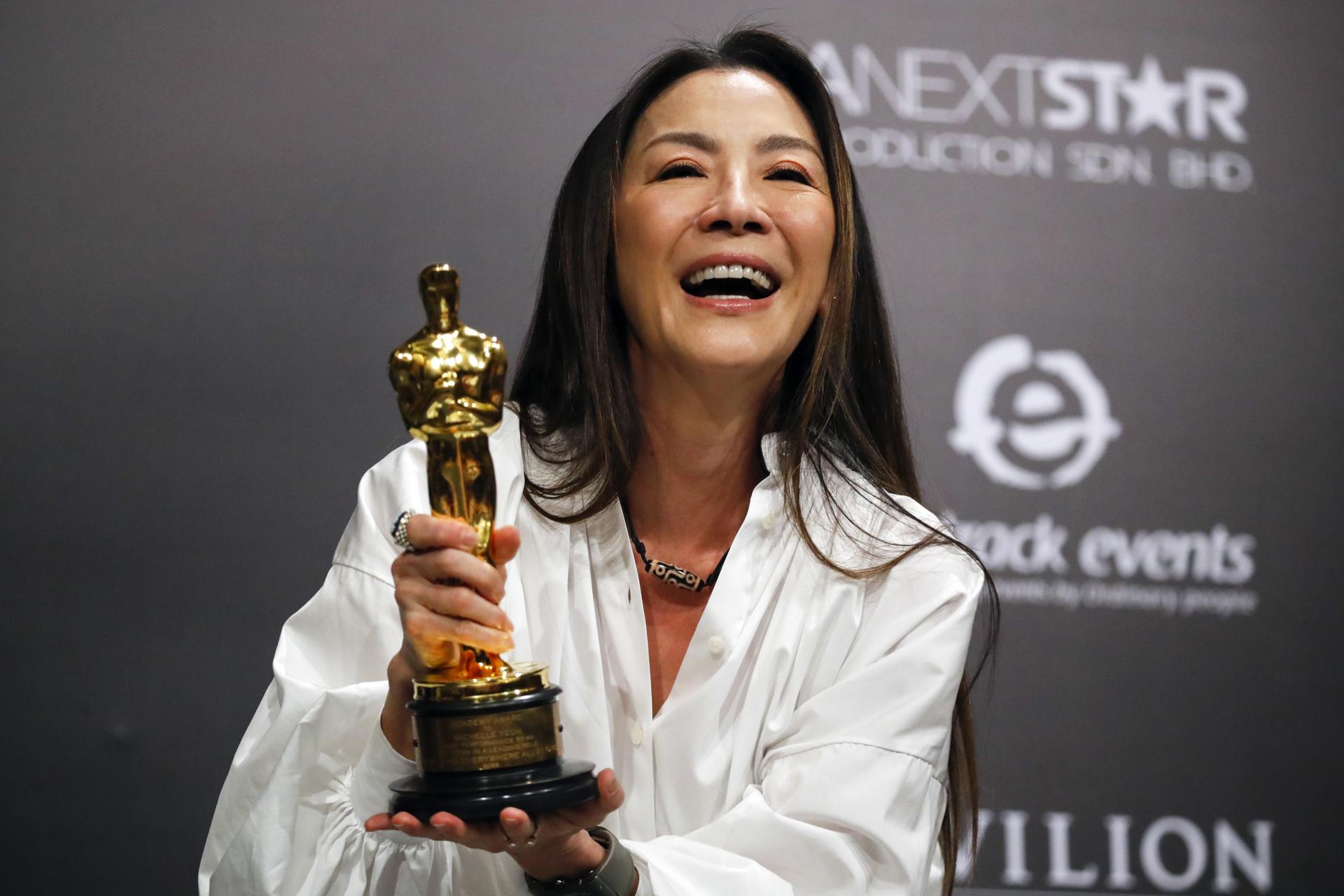 Michelle Yeoh holds her Oscar for Best Actress for 'Everything Everywhere All at Once' at press conference in Kuala Lumpur, Malaysia, 18 April 2023. EFE-EPA FILE/FAZRY ISMAIL