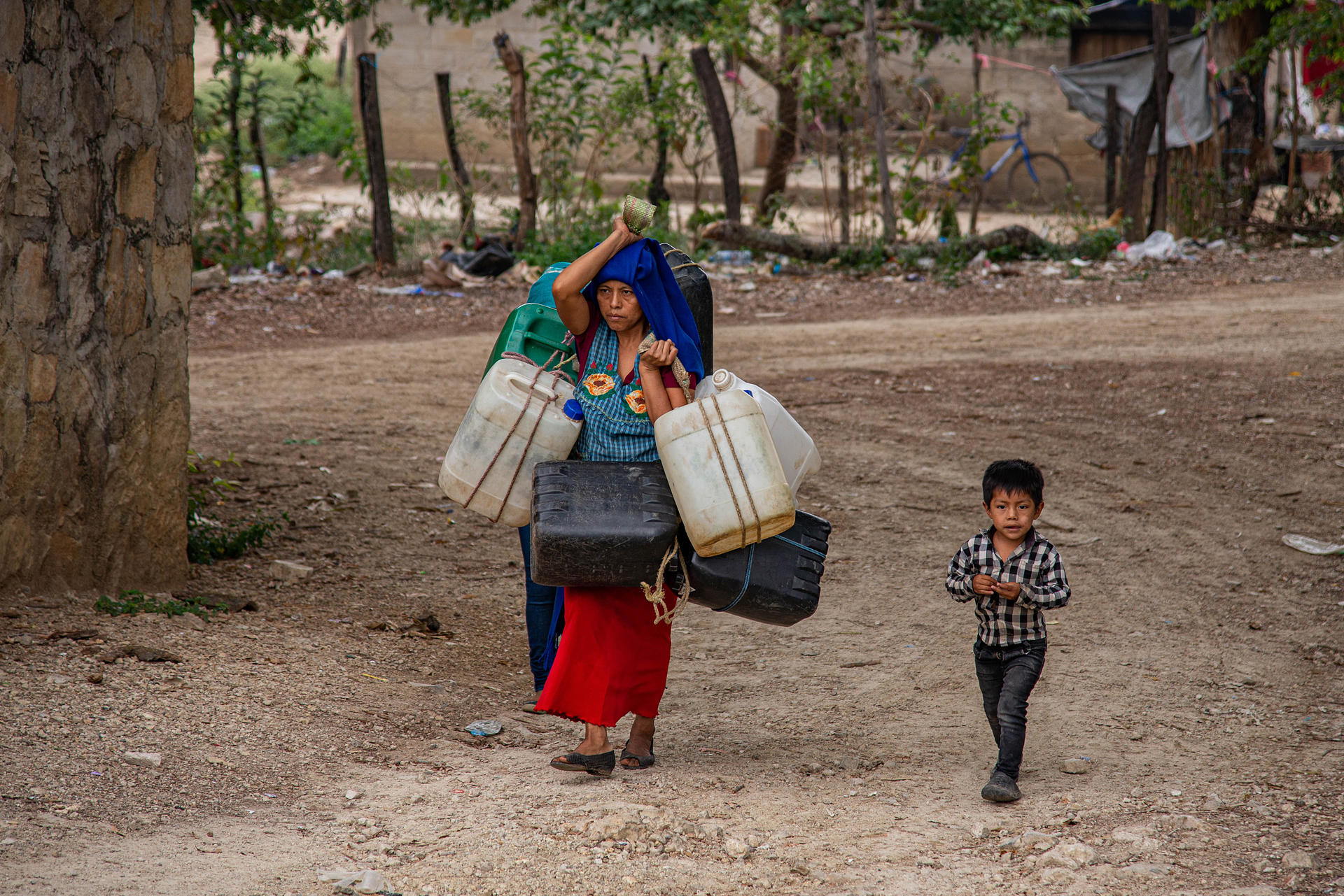 A Tzotzil Maya resident of the community of Guadalupe Xu’kun, located in the southeastern Mexican state of Chiapas, on 22 June 2023 carries a container of water that she filled in the nearby town of Zinacantan. EFE/Carlos Lopez
