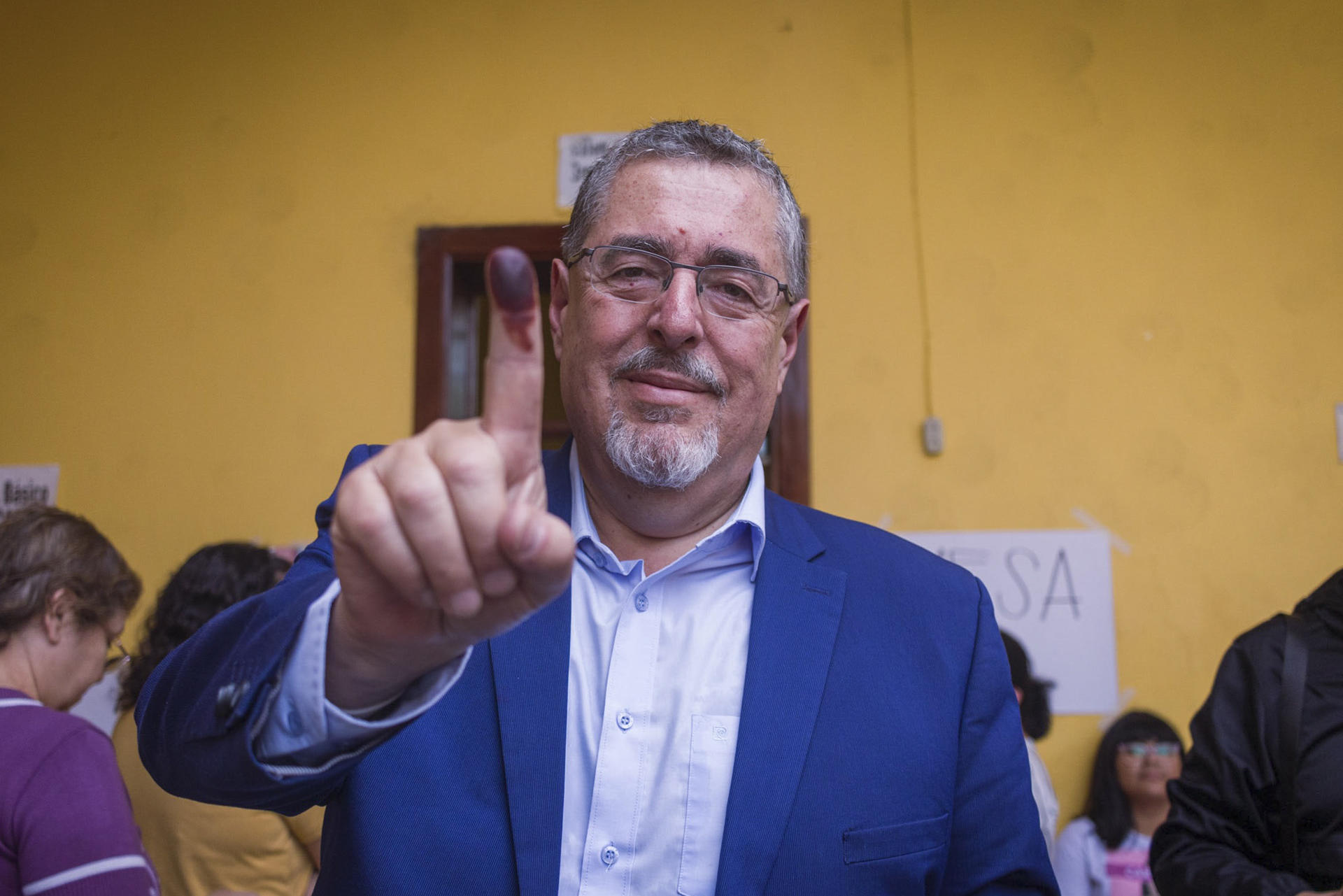 Guatemalan party Movimiento Semilla (Seed Movement)'s Presidential candidate, Bernardo Arevalo (up), displays his tinted finger together after he cast his ballot in general election at a polling station in Guatemala City, Guatemala, on 25 June 2023 (issued on 26 June 2023). EFE-EPA/Diego Alvarado
