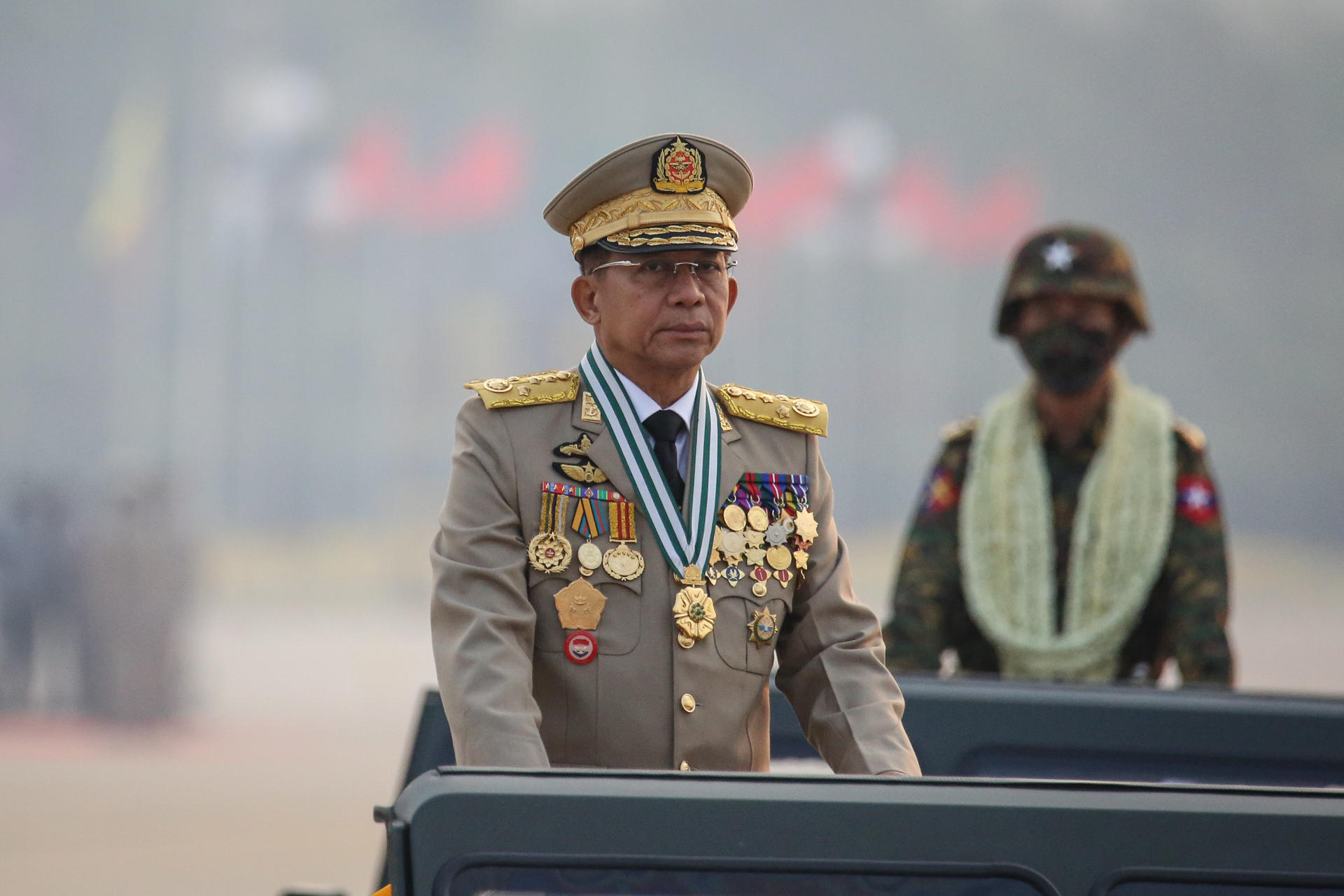 Myanmar military Commander-in-Chief Senior General Min Aung Hlaing (L) participates in a parade during the 76th Armed Forces Day in Naypyitaw, Myanmar, 27 March 2021. EPA-EFE FILE/STRINGER
