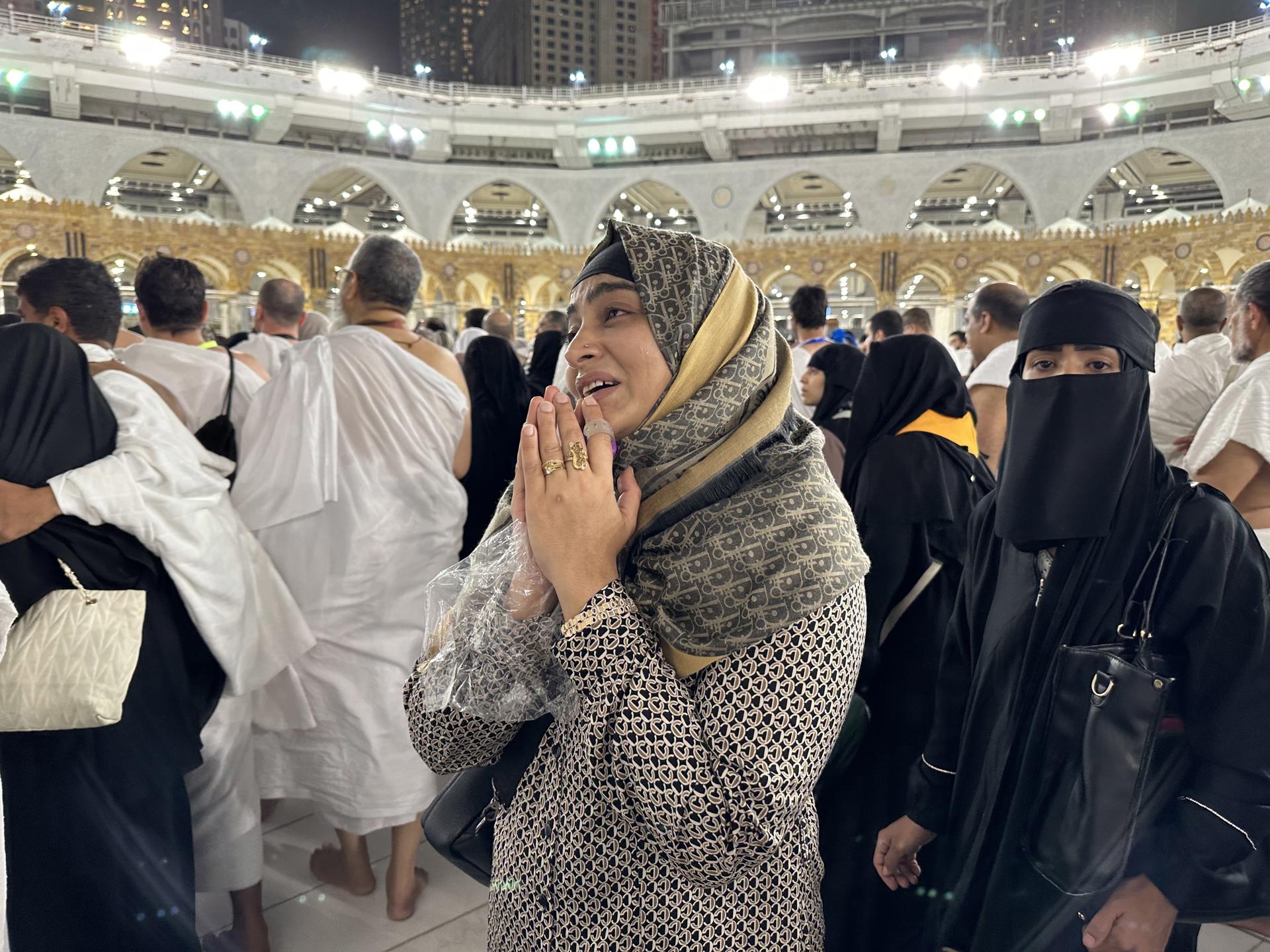 A Muslim woman prays near Kaaba, the holiest site in Islam, as people perform the Tawaf (circumambulation) and pray at al-Masjid al-Haram, in preparation of the start of the Hajj 2023 pilgrimage, Mecca, Saudi Arabia, 25 June 2023 (issued 26 June 2023). EFE/EPA/ASHRAF AMRA