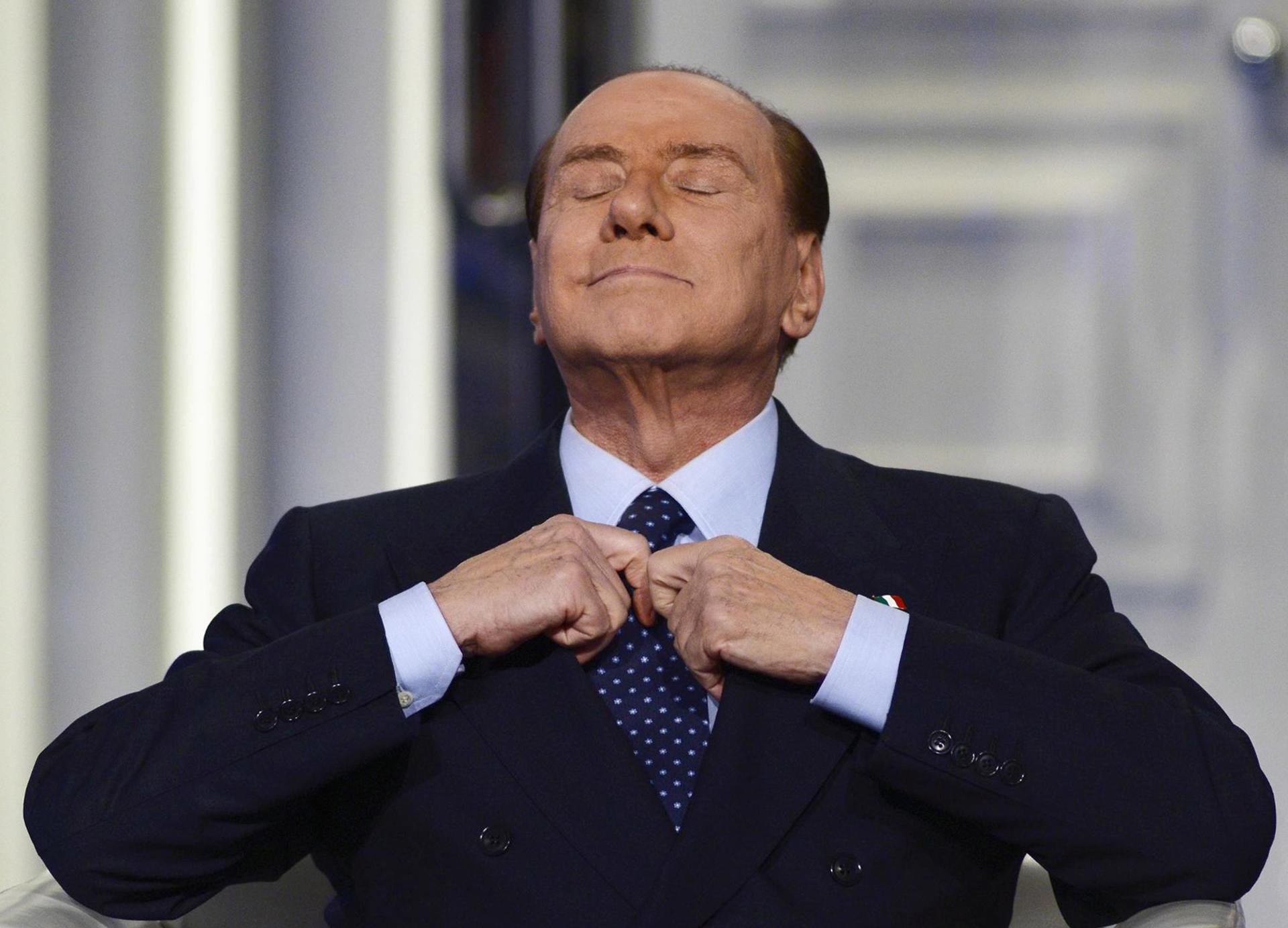 Former Italian Prime Minister Silvio Berlusconi adjusting his tie during the recording of the Italian Rai 1 television program 'Porta a porta', in Rome, Italy, 18 December 2012 (reissued 12 June 2023). EFE-EPA/GUIDO MONTANI
