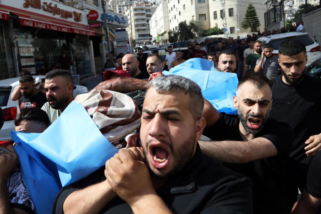 Palestinians carry the bodies of two men killed during an Israeli raid in the Old city of Nablus, northern West Bank, 07 July 2023. EFE-EPA/ALAA BADARNEH

