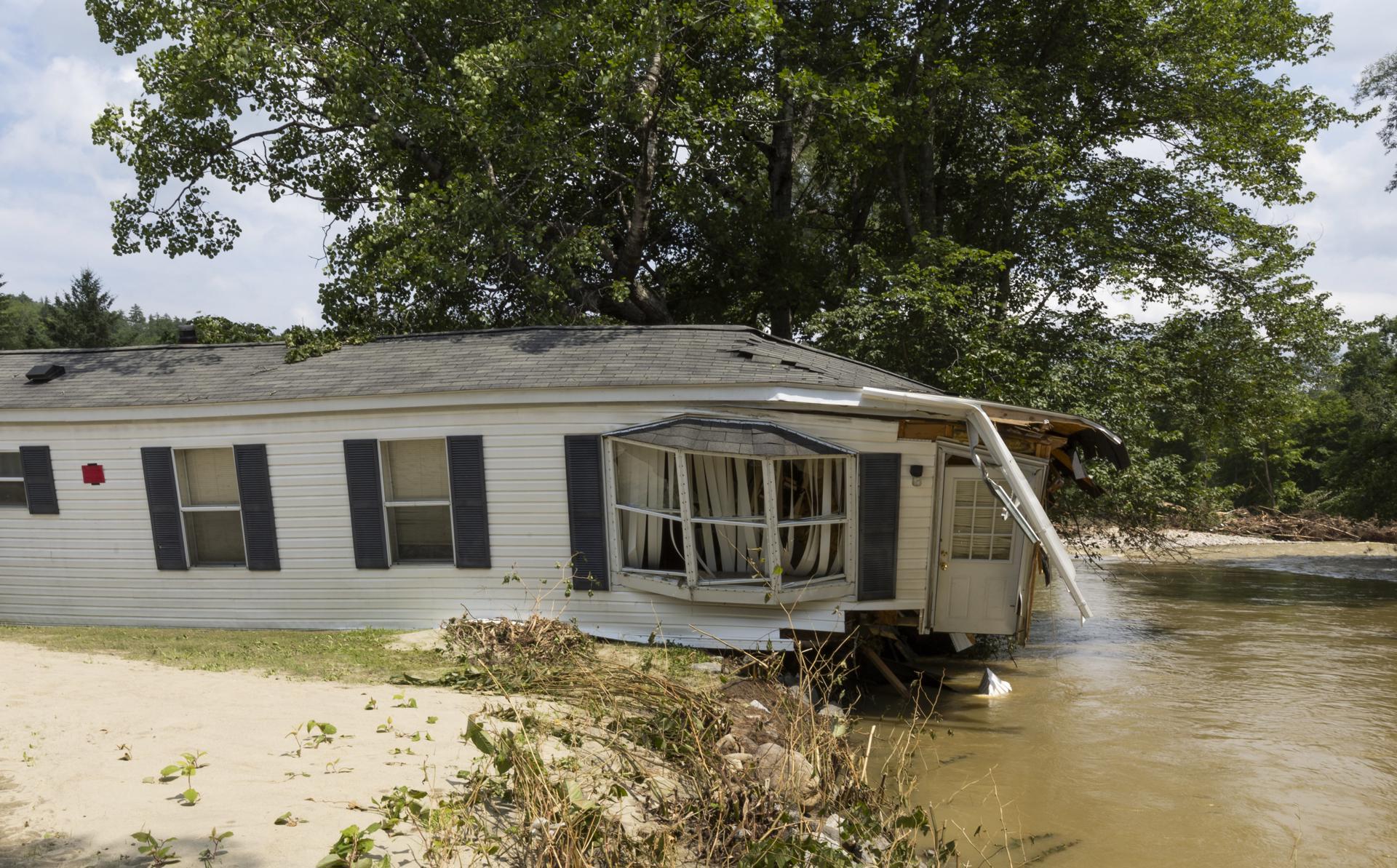 A view of a home affected by rain-triggered flooding near Black River in Ludlow, Vermont, on 13 July 2023. EFE/Cj Gunther

