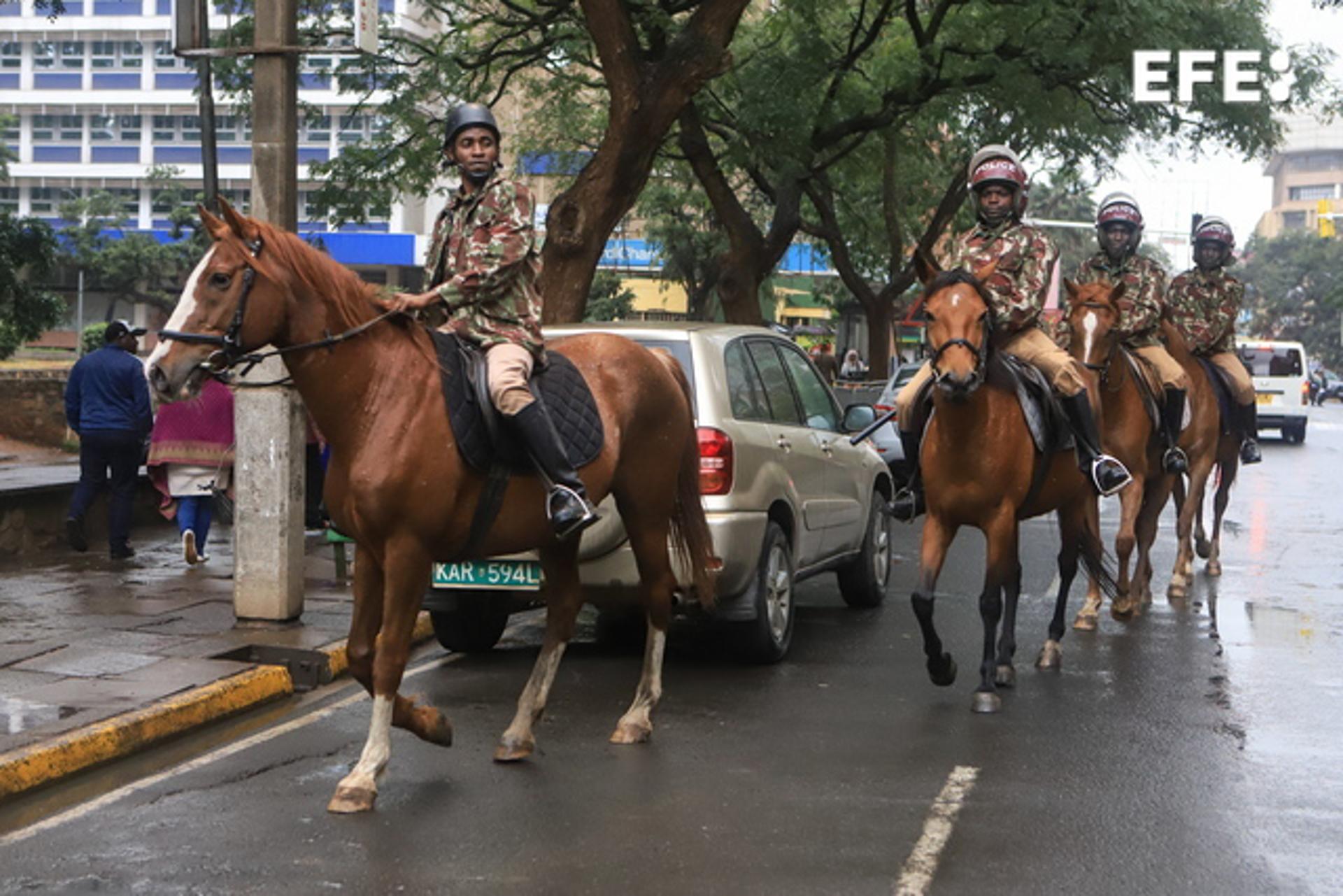 Kenyan mounted police patrol the central business district during a rally against tax increases in Nairobi on 7 July 2023. EFE/EPA/STRINGER
