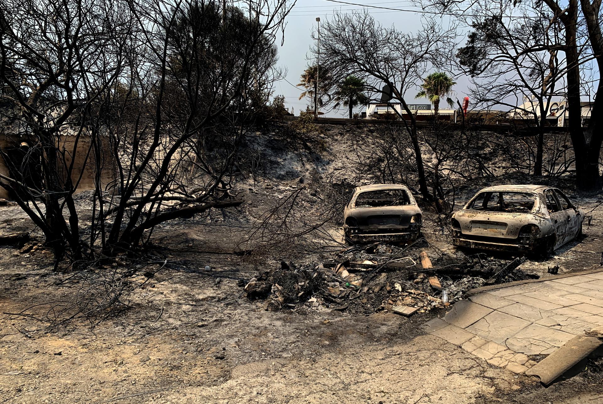 Burnt cars are seen after a wildfire in Kiotari village, on Rhodes island, Greece, 23 July 2023. EFE/EPA/DAMIANIDIS LEFTERIS